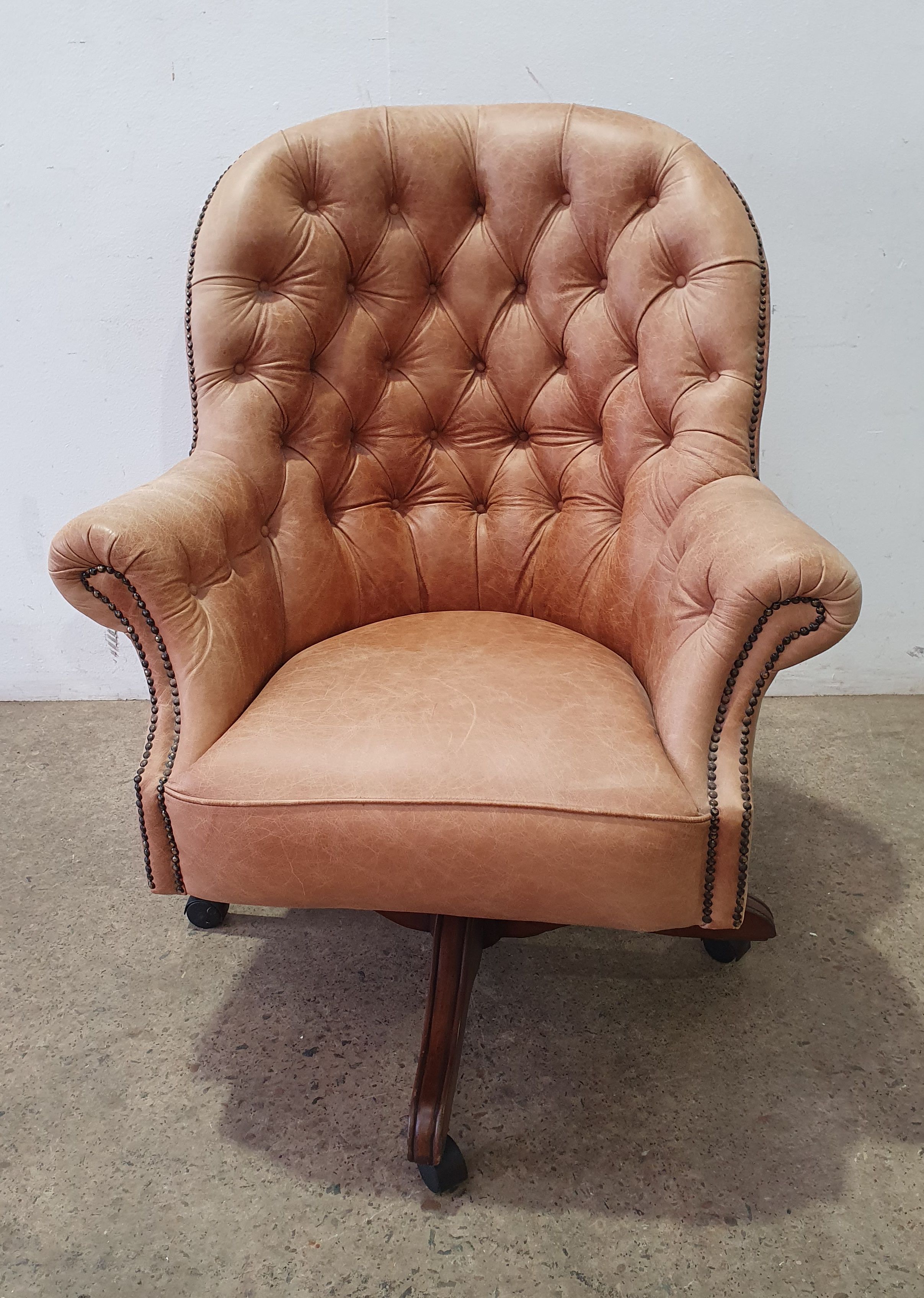 A Leather Button Back Swivel Study Chair