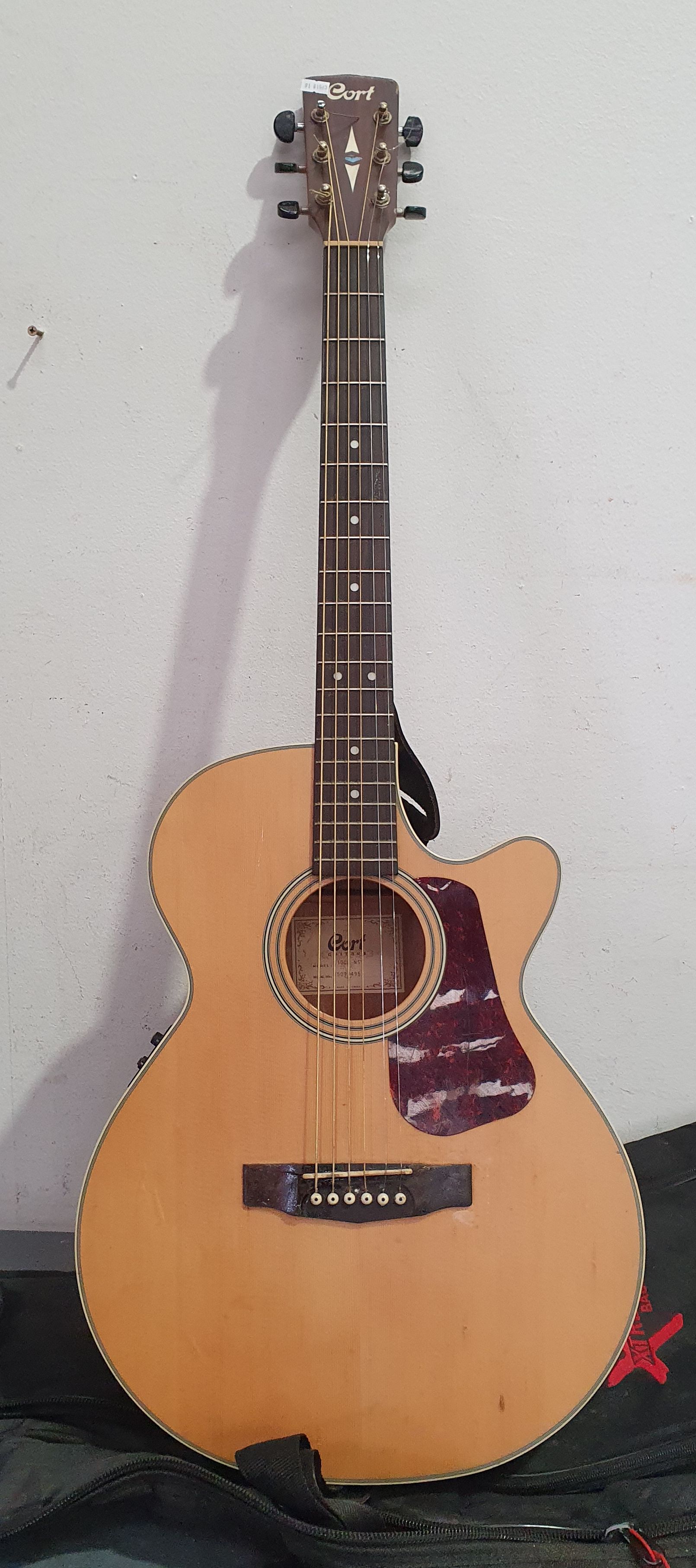 A CORT ACOUSTIC GUITAR