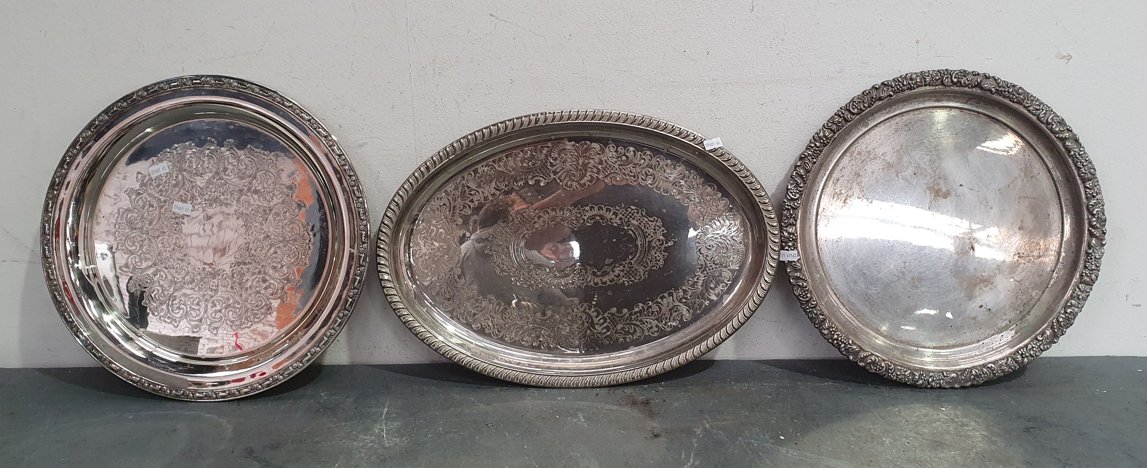 THREE SILVERPLATE SERVING PLATES