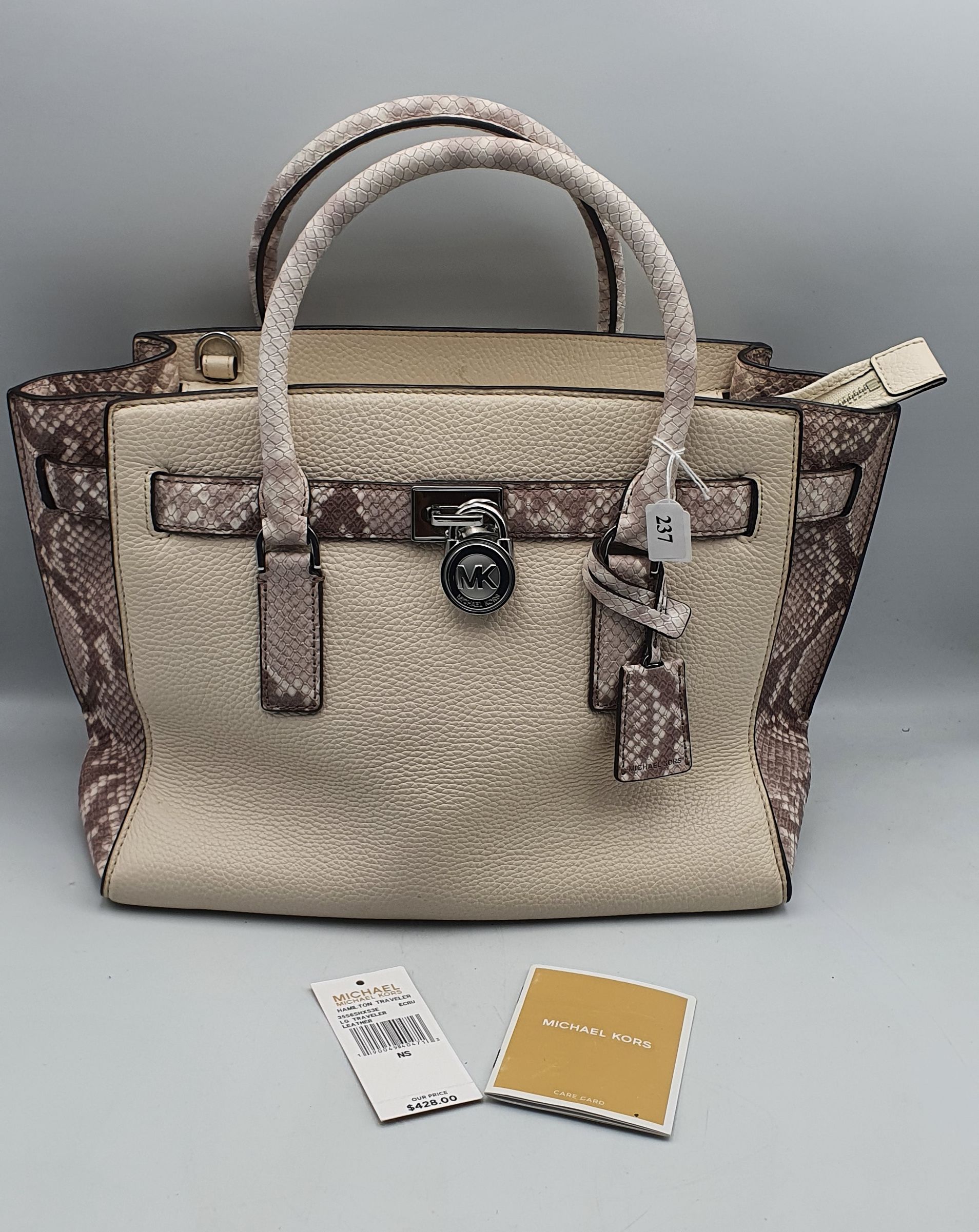 237 · A MICHAEL KORS 'HAMILTON TRAVELER' ECRU LEATHER HANDBAG