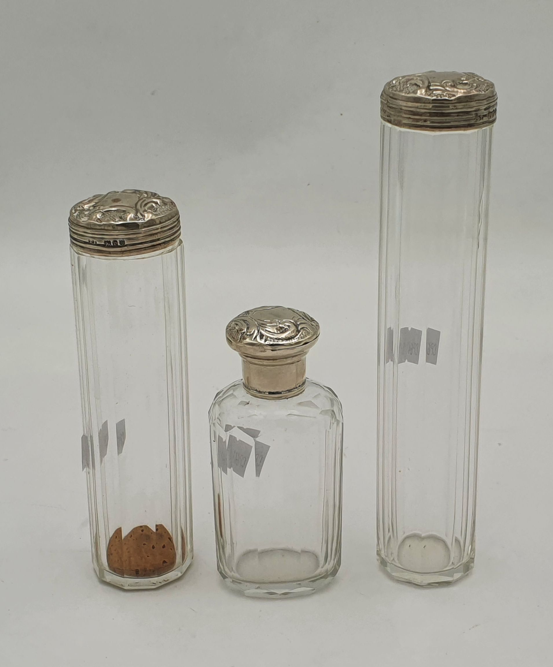 536 · THREE SILVER TOPPED VANITY BOTTLES