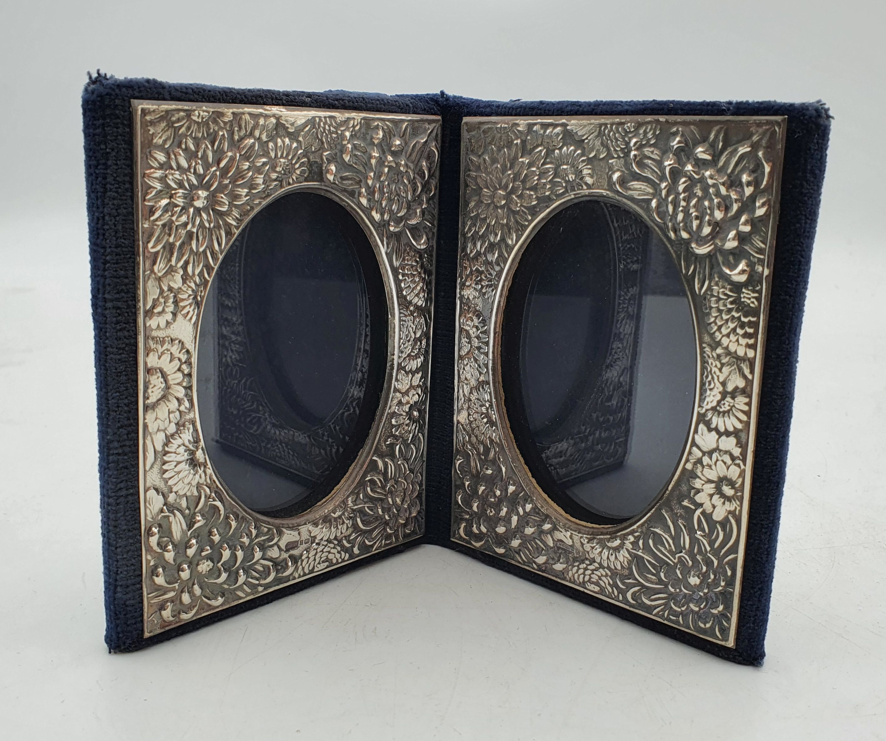 503 · AN ELIZABETH II SILVER MOUNTED DOUBLE PHOTOGRAPH FRAME