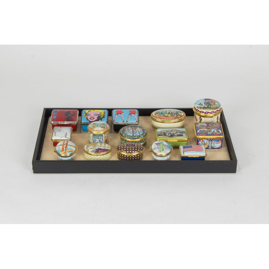 A group of fifteen Halcyon Days enamel boxes