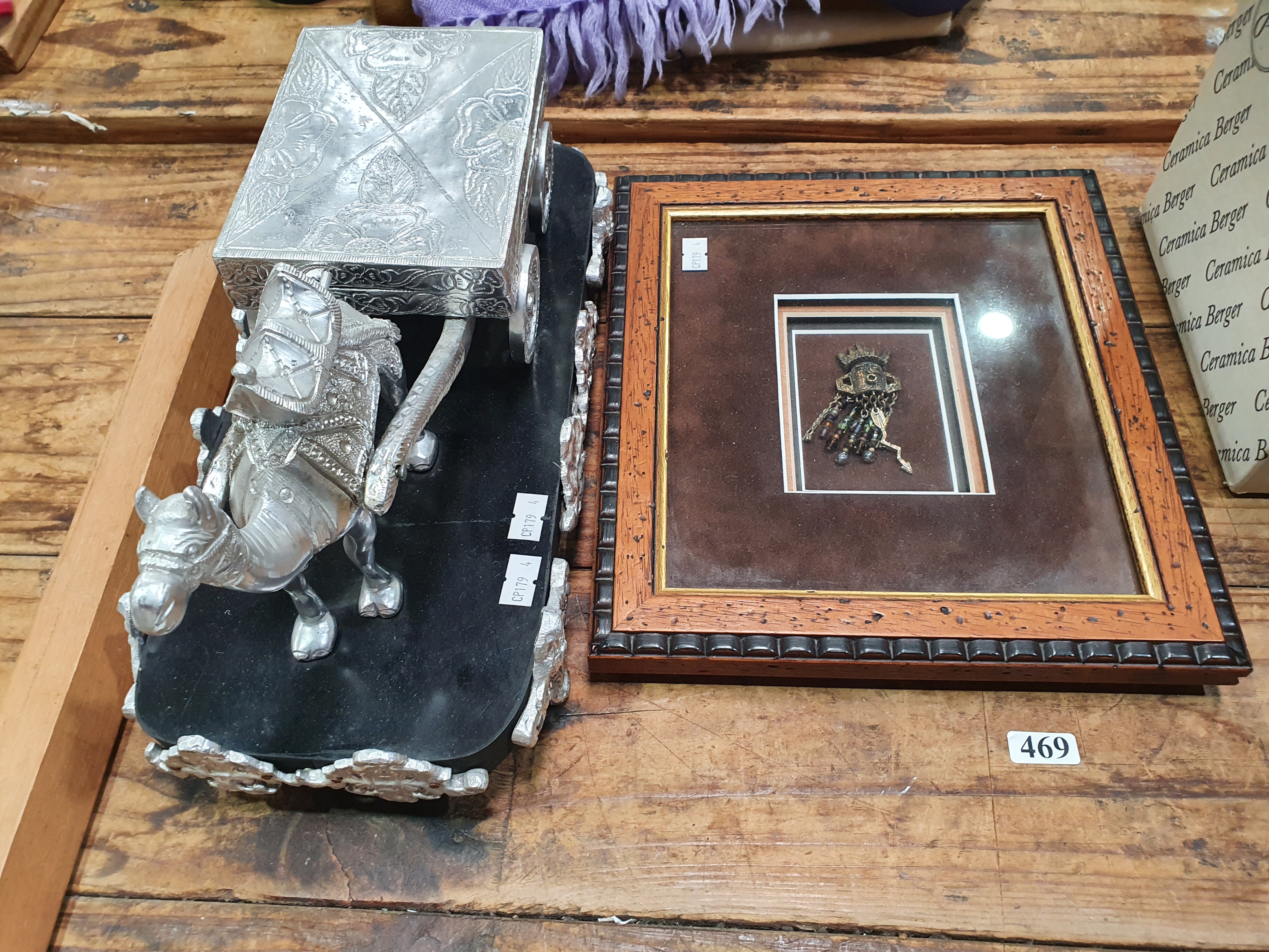469 · AN INDIAN DECORATIVE SILVER COLOURED METAL CAMEL AND CART SHAPED PLAYING CARD BOX