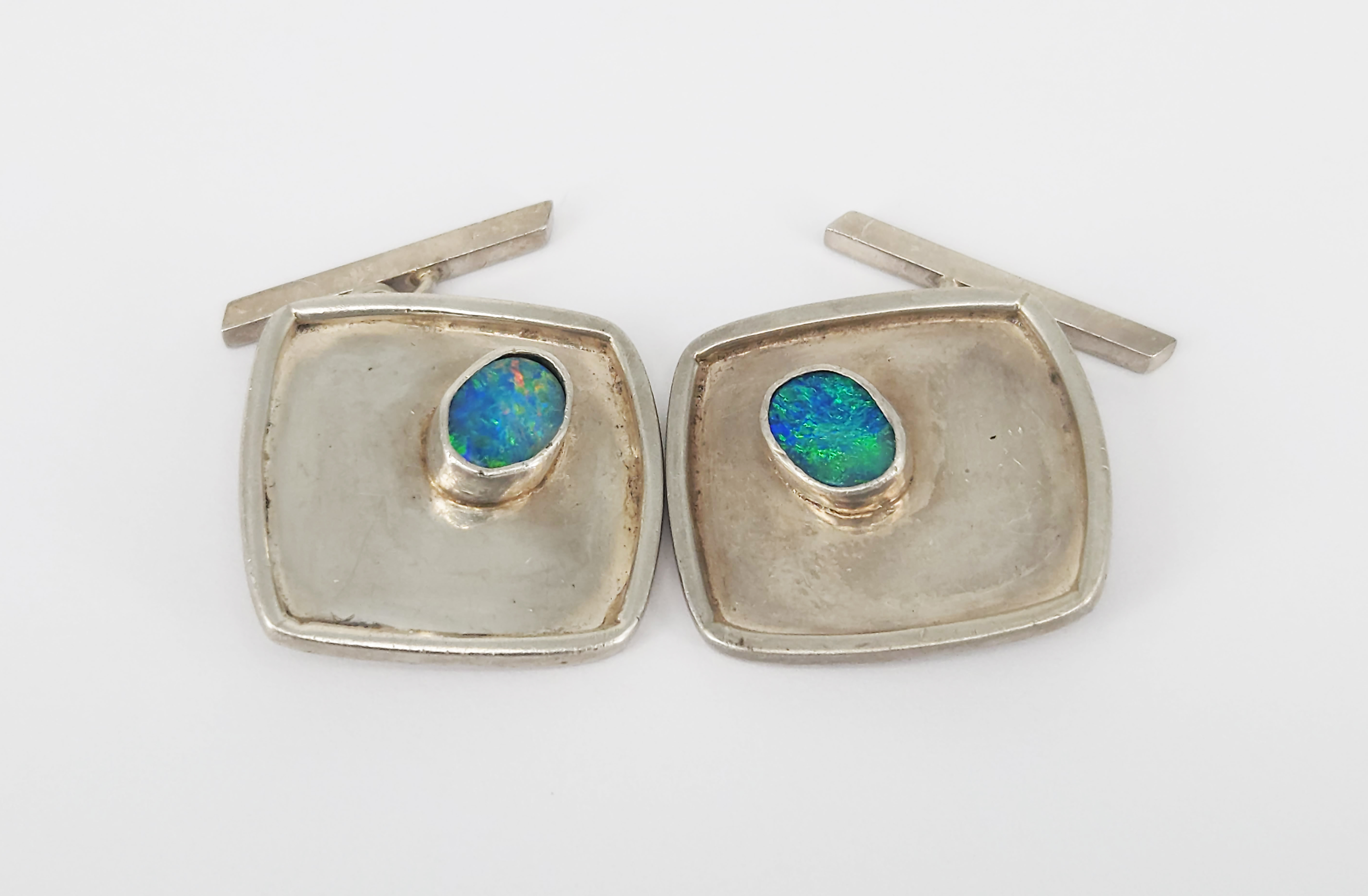 310 · A VINTAGE PAIR OF SILVER AND OPAL CUFFLINKS