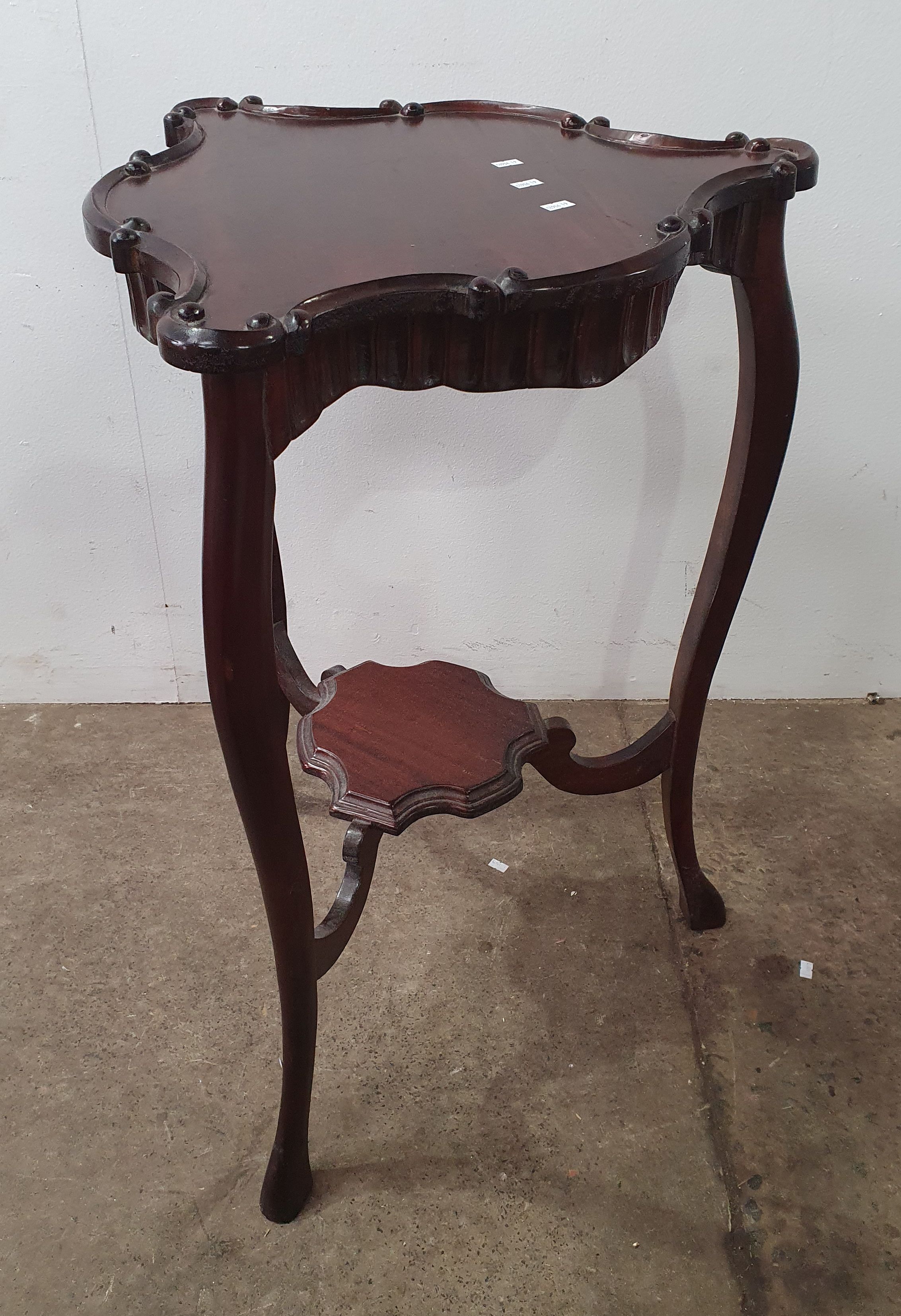 A Carved Mahogany Occasional Table