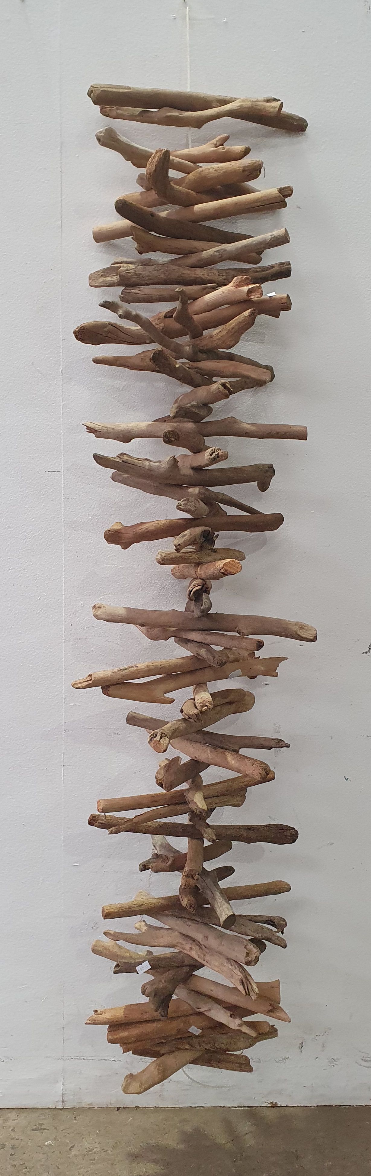 A WOODEN DECORATIVE HANGING PIECE
