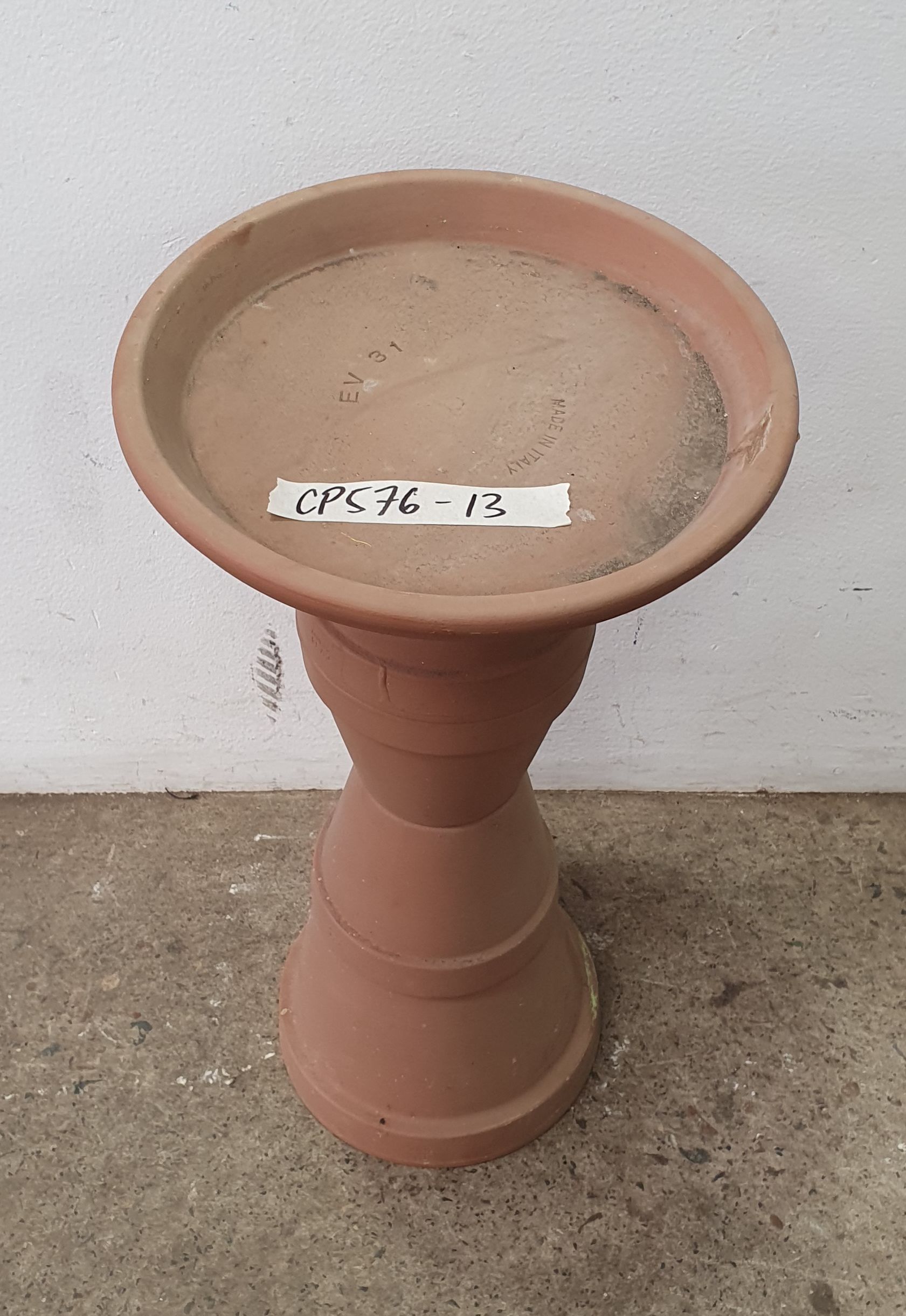 1078 · A TERRACOTTA PLINTH