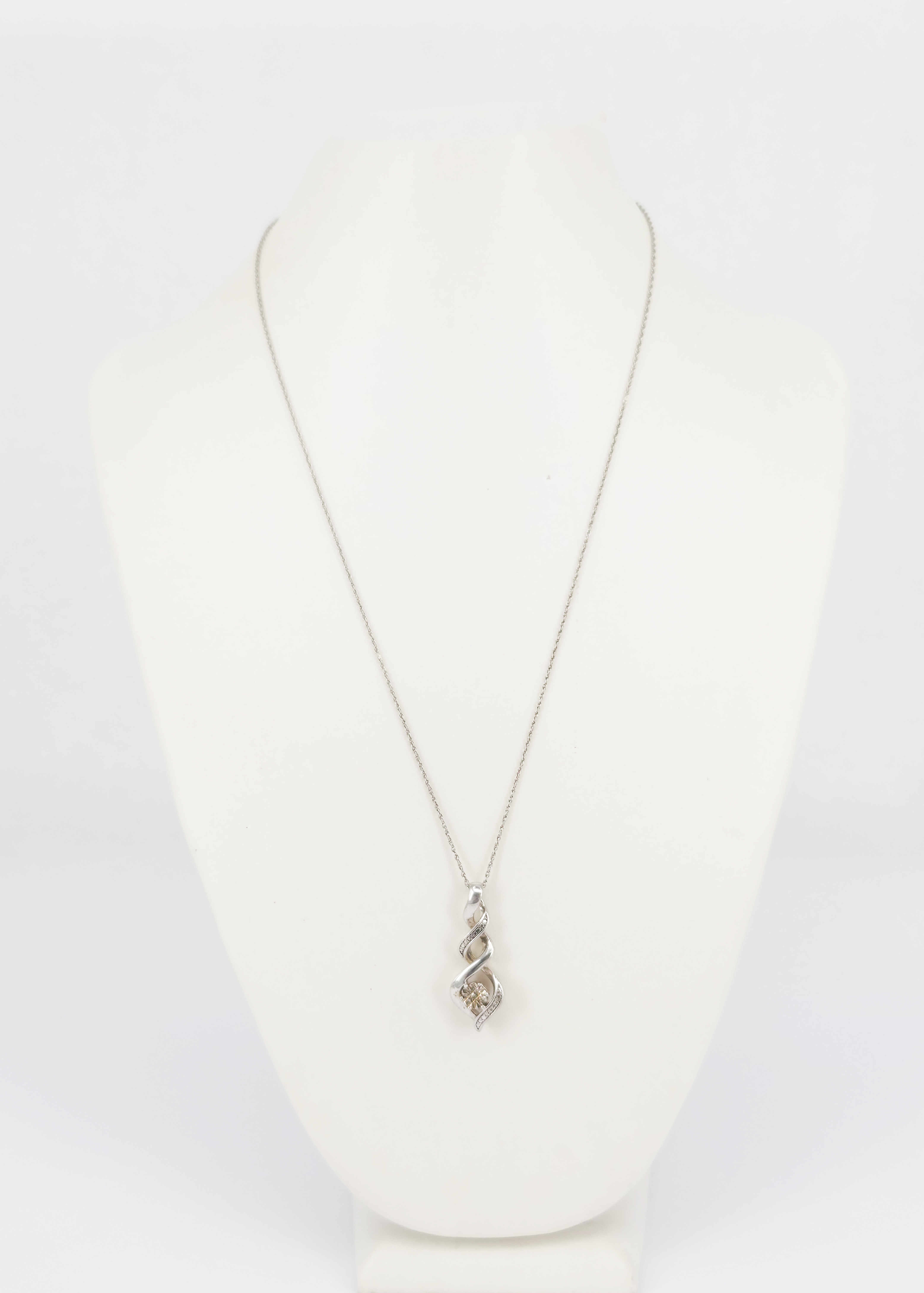 393 · A SILVER AND DIAMOND PENDANT