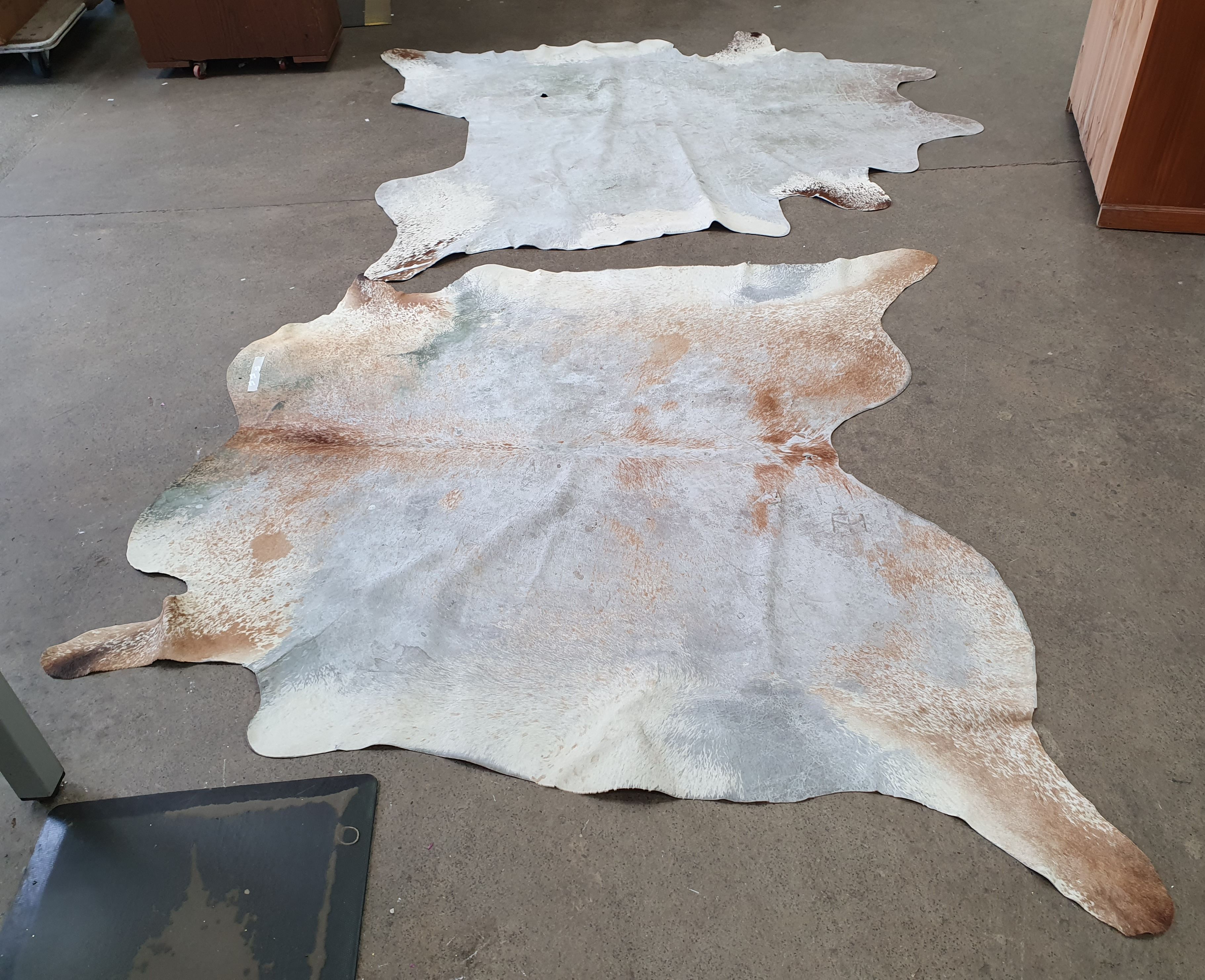Two Cowskin Rugs