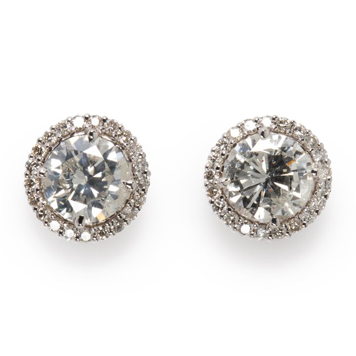 A pair of diamond and eighteen karat white gold earrings