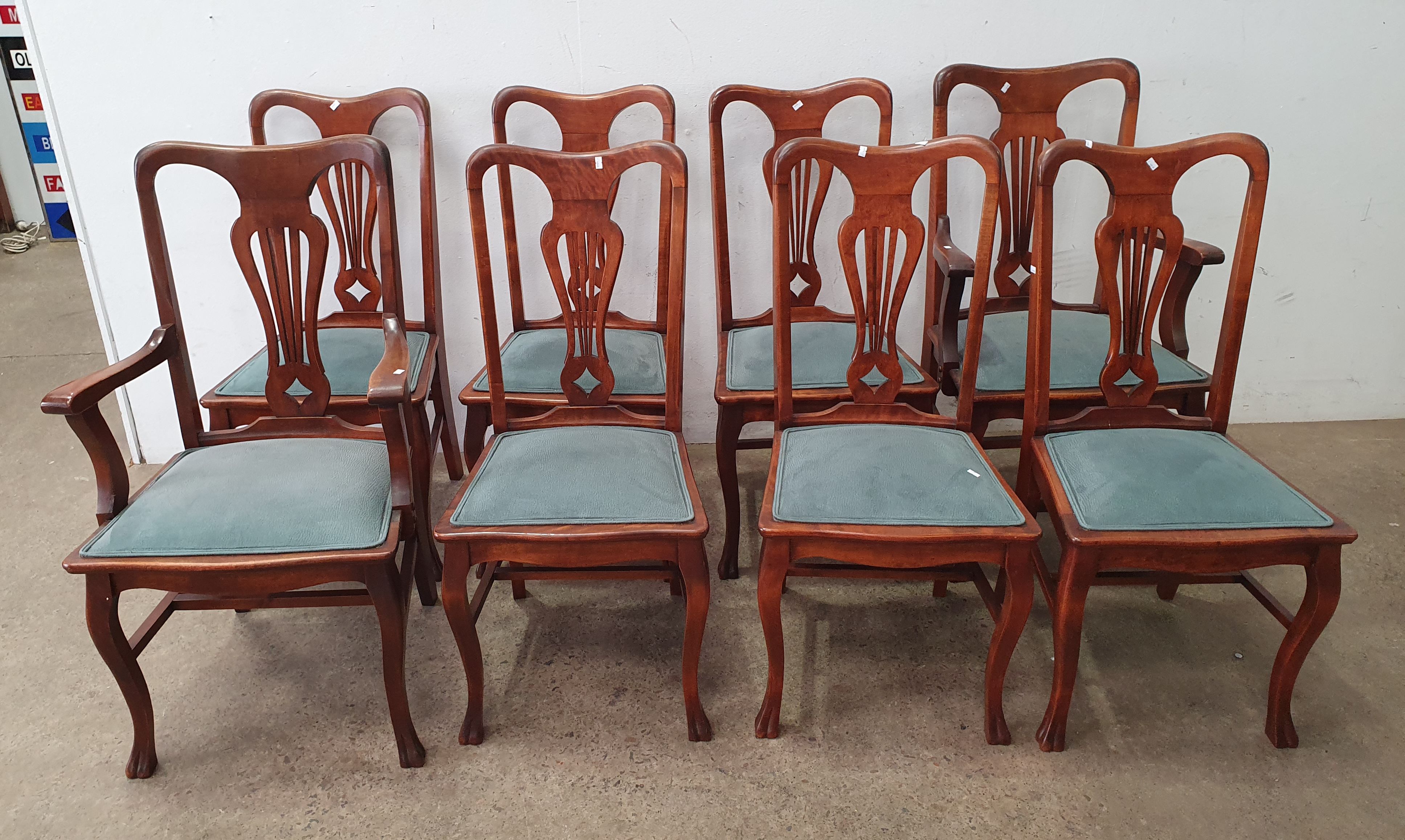 A Set Of Eight Lyre Back Dining Chairs