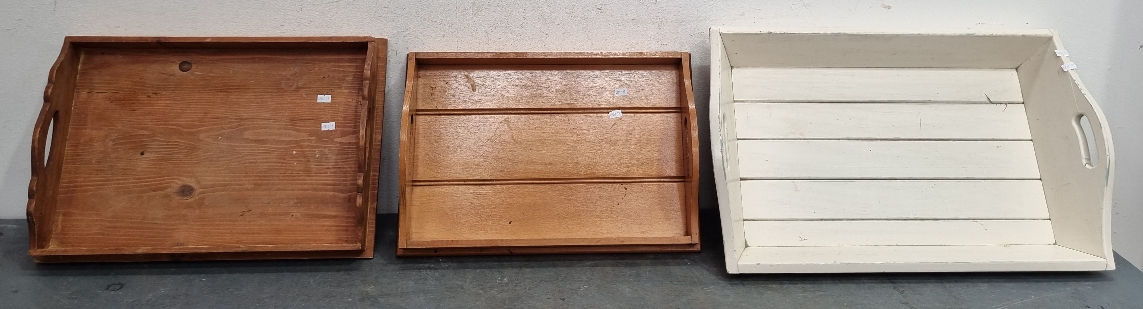 A GROUP OF THREE SERVING TRAYS