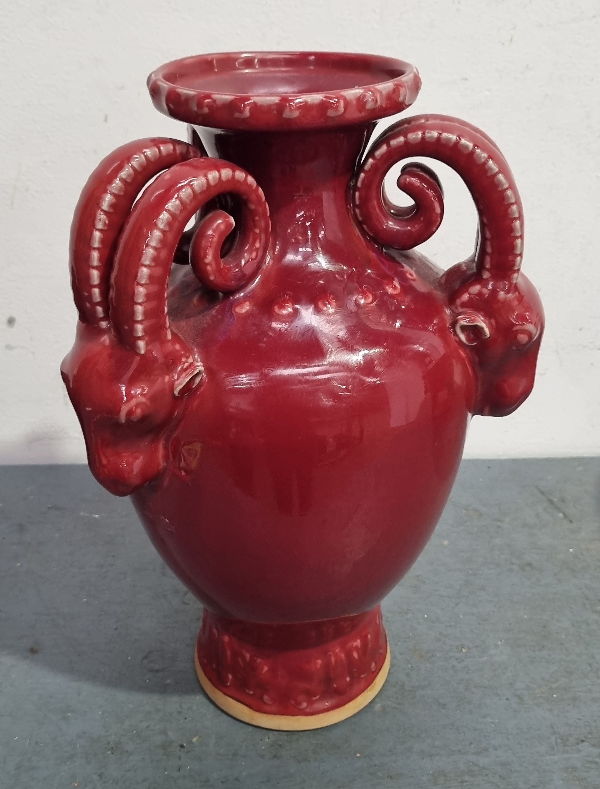 A THREE HANDLE RAM THEMED VASE