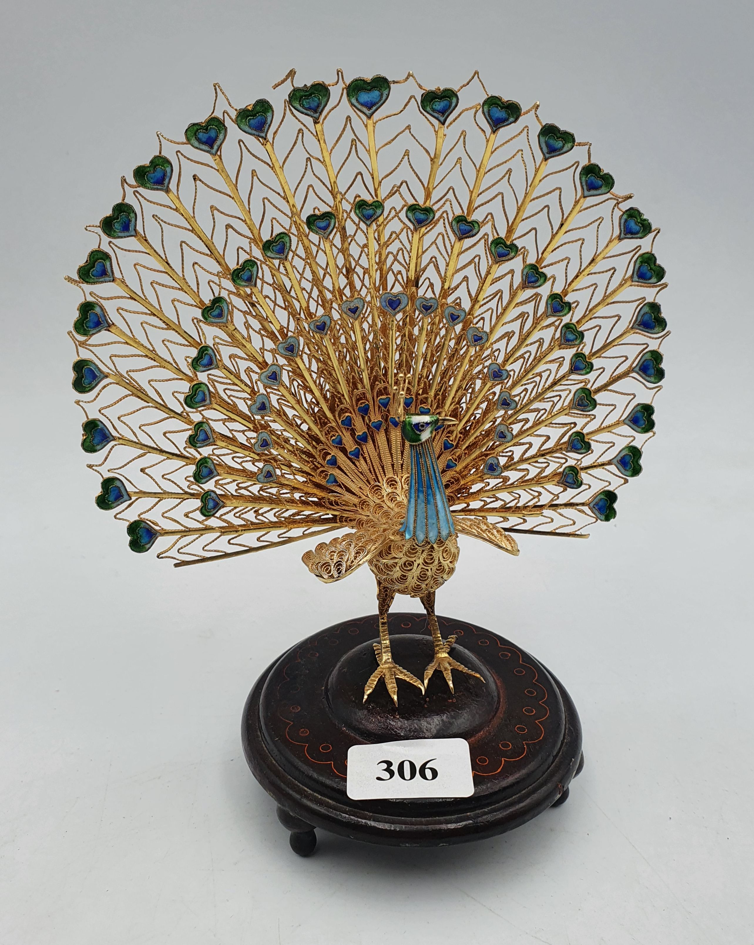 306 · A VINTAGE GILT SILVER AND CLOISONNE ENAMEL PEACK FIGURE