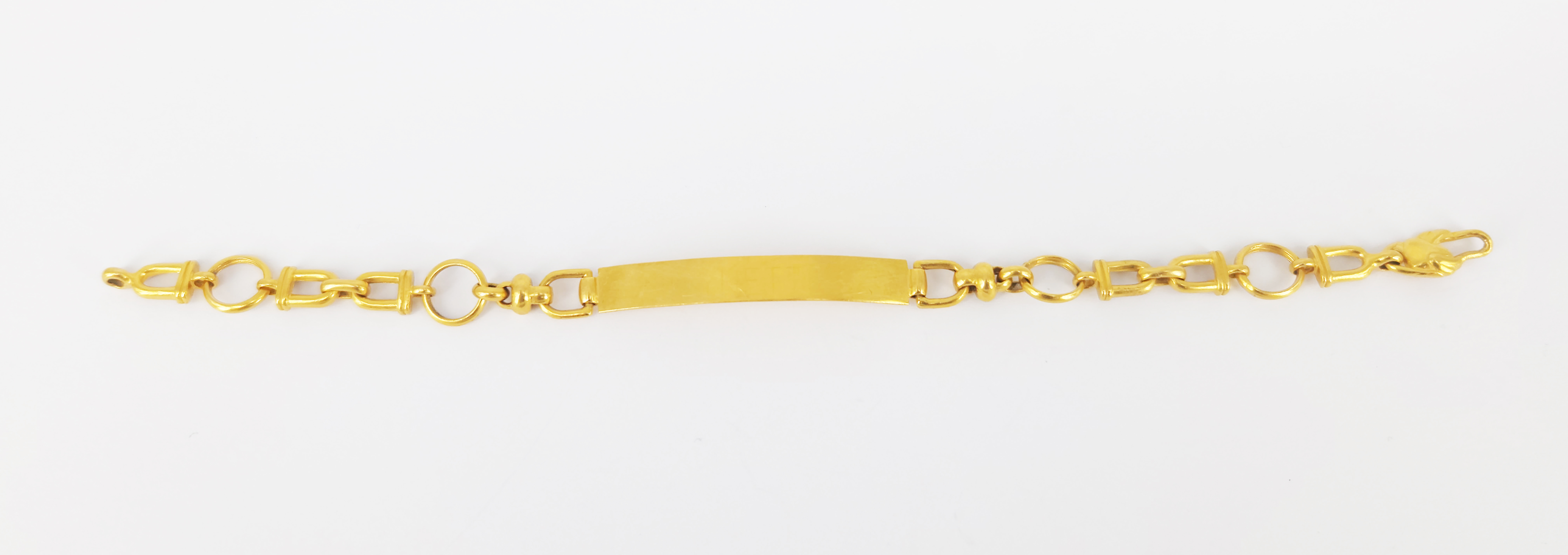 61 · AN ASIAN YELLOW GOLD STIRRUP LINK IDENTITY BRACELET
