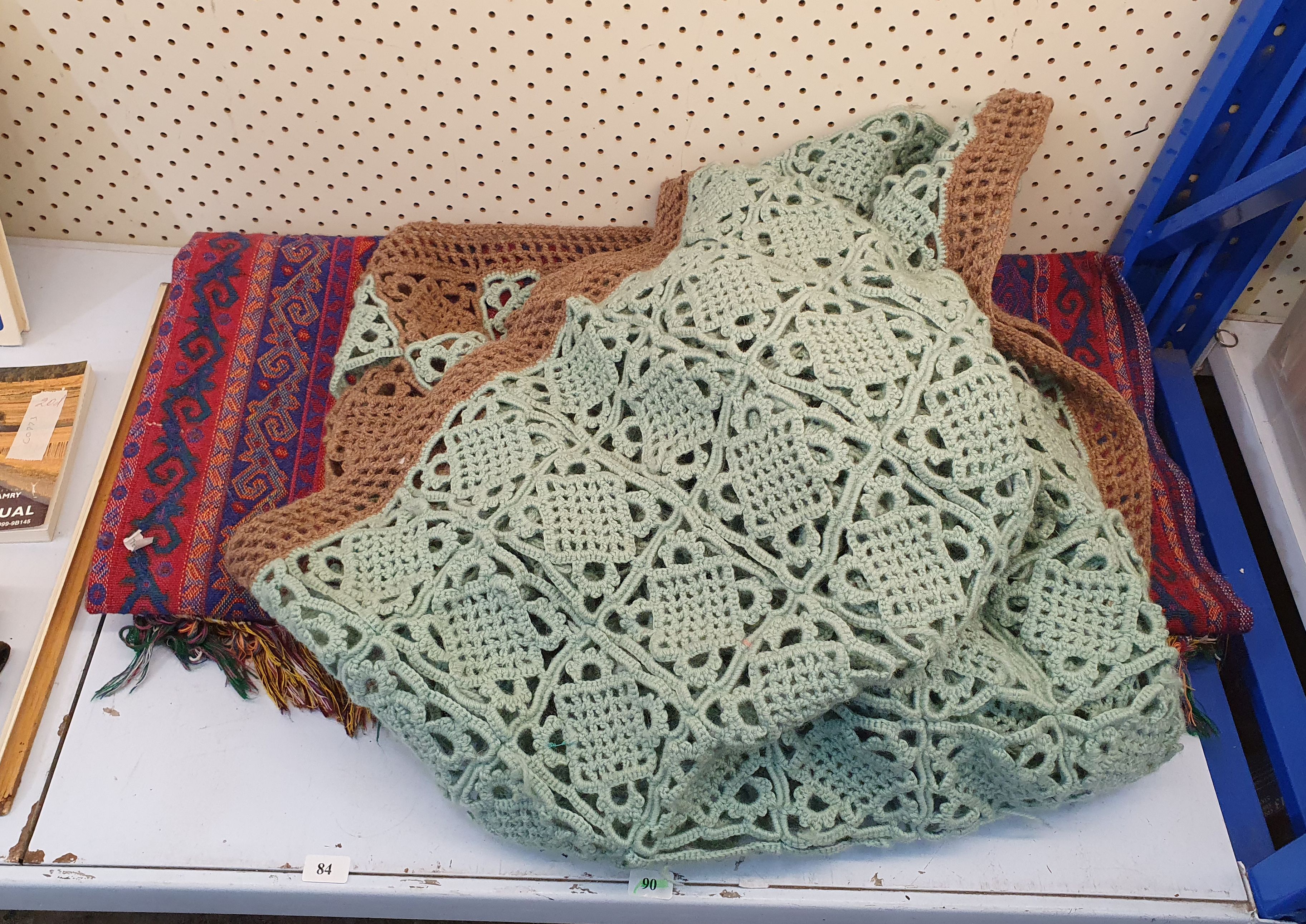 A Crocheted Rug And A Woven Rug