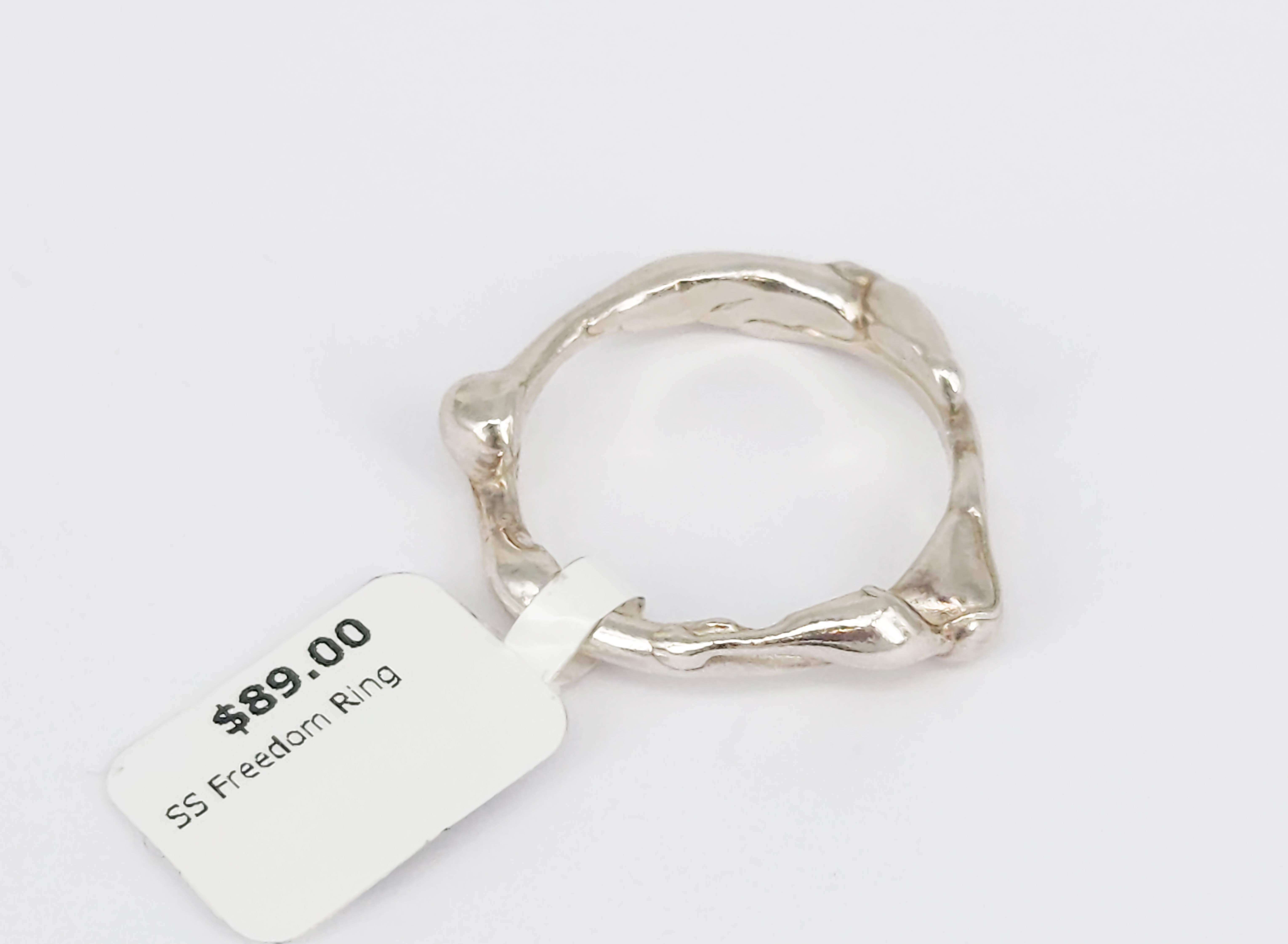 396 · A STERLING SILVER 'FREEDOM' POURED RING