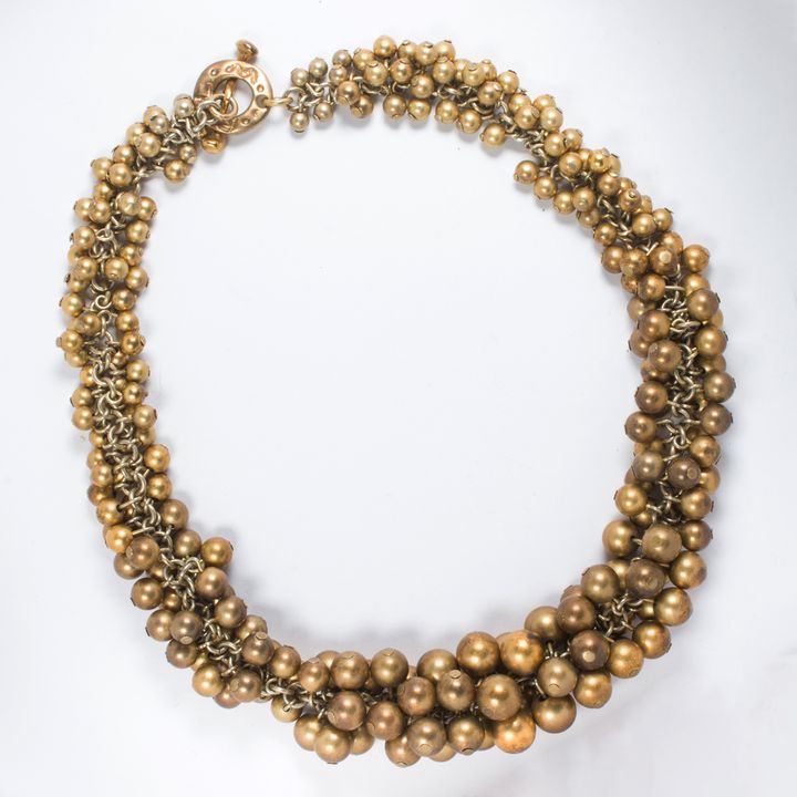 Robert lee Moris, a gold plated necklace
