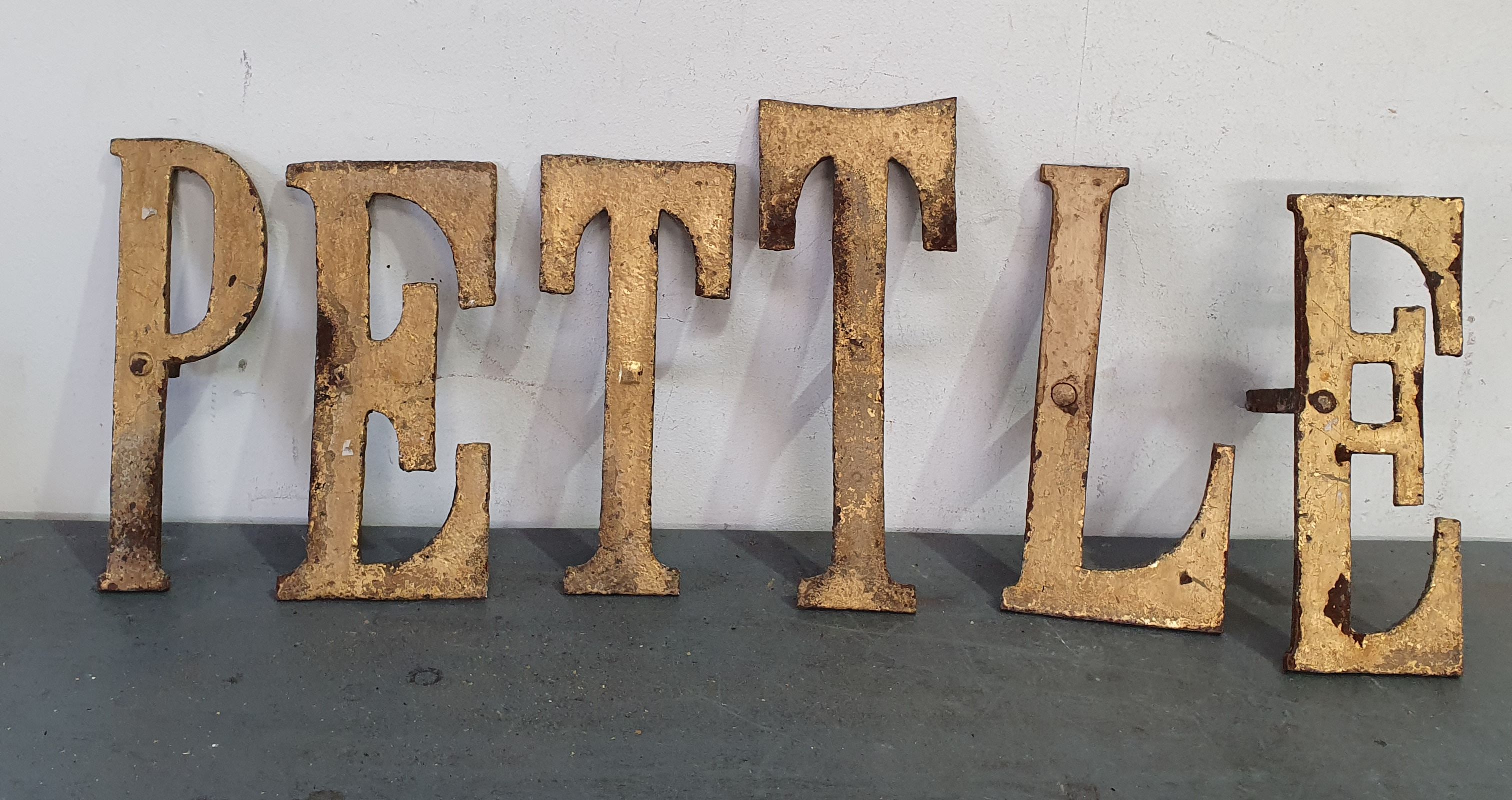 1145 · SIX DECORATIVE HEAVY WROUGHT IRON LETTERS