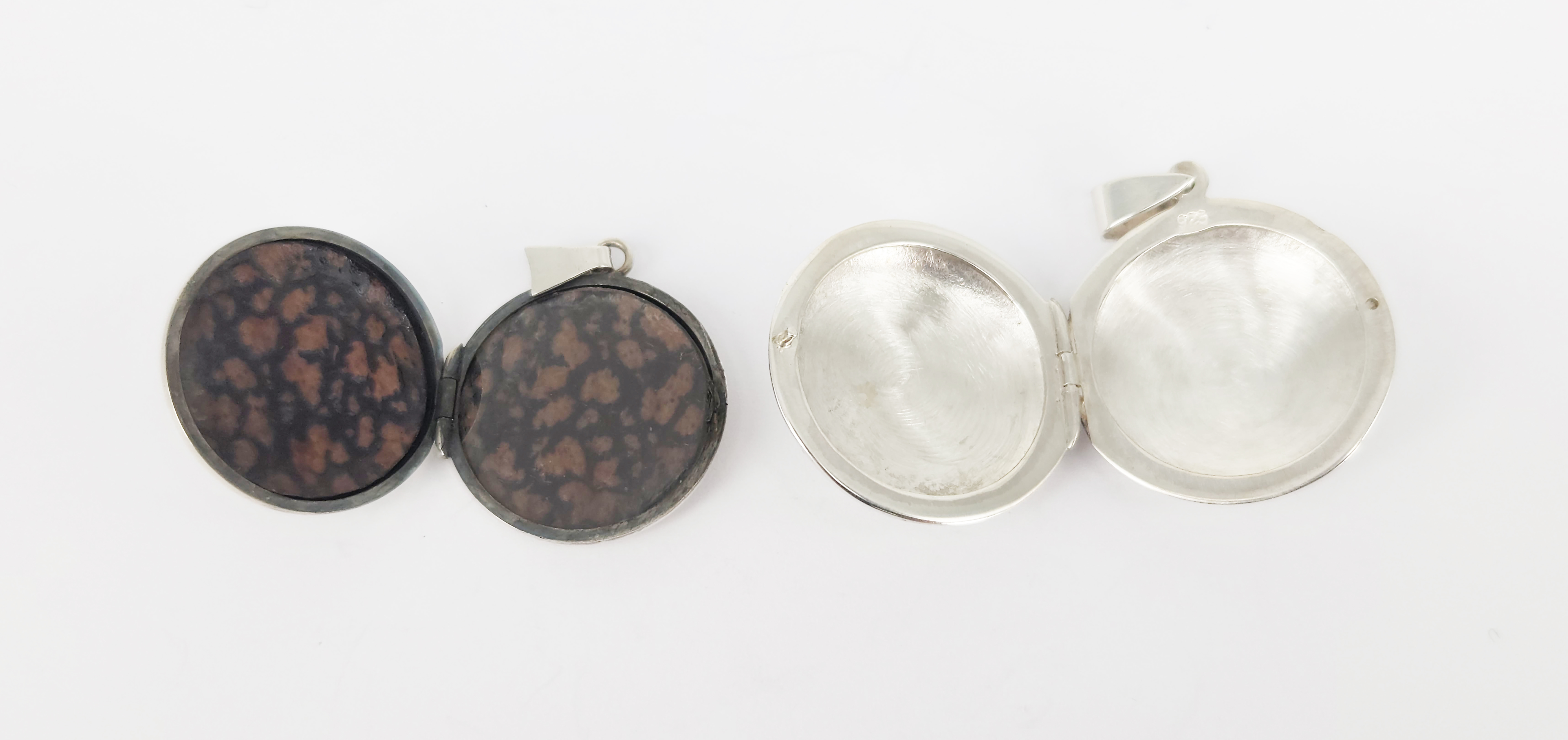 306 · TWO SILVER LOCKET PENDANTS