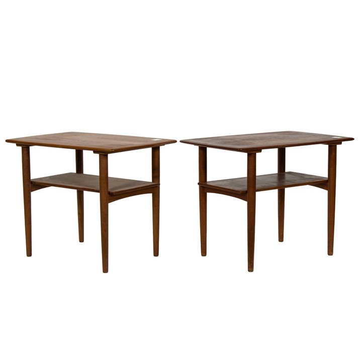 A pair of Danish Povl Dinesen teak two tiered end tables