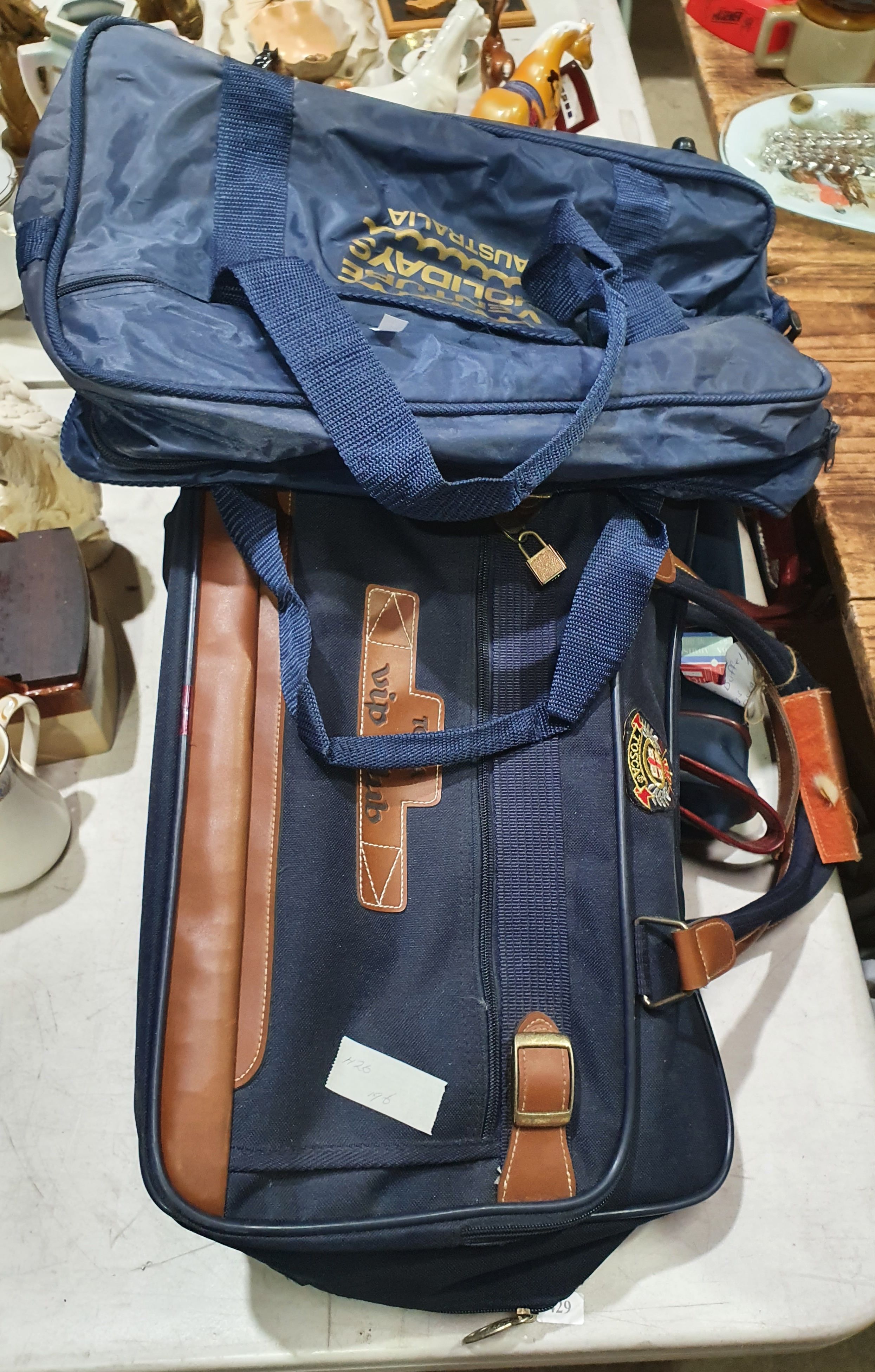 THREE SMALL TRAVEL BAGS