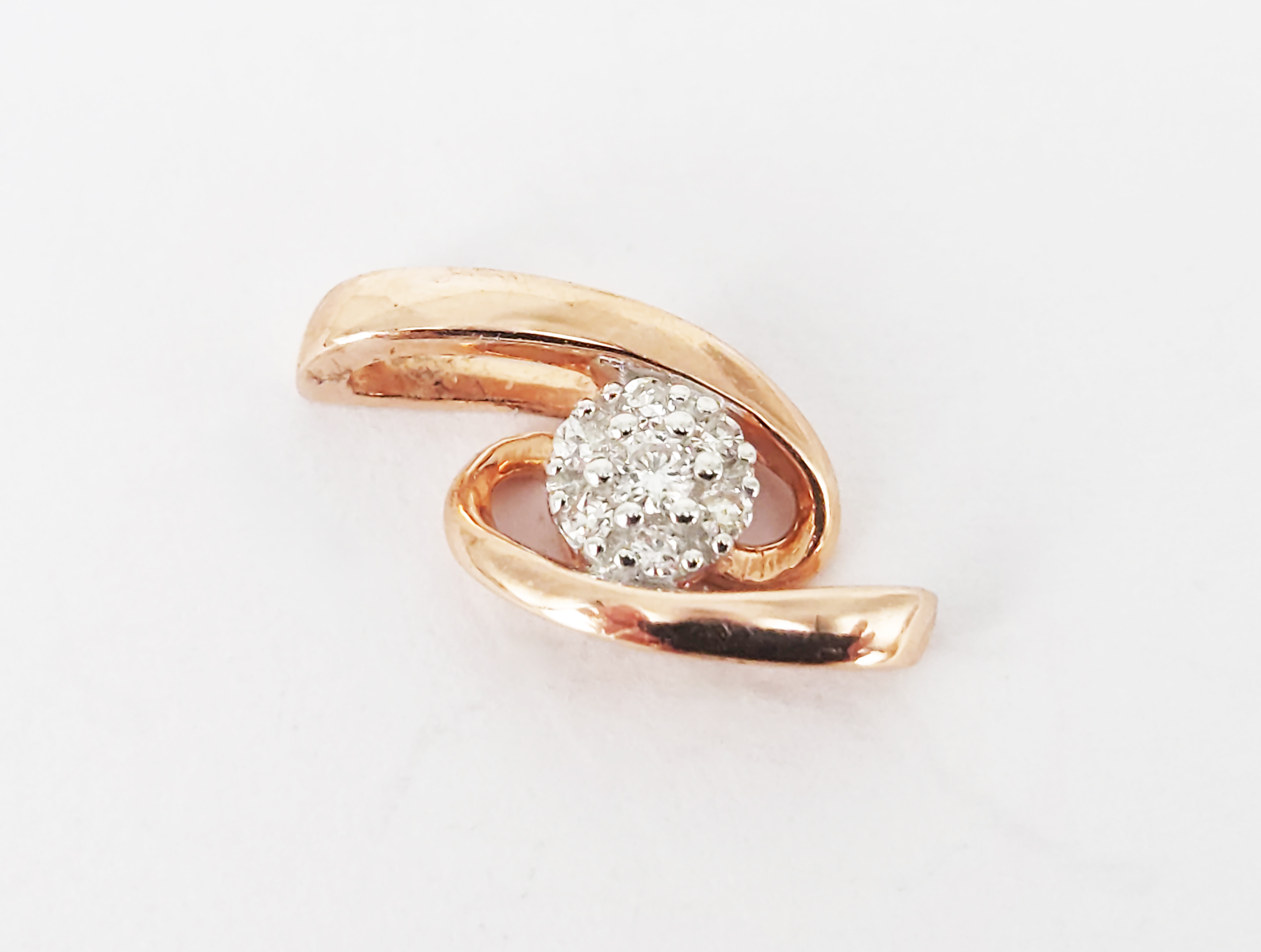 A 9ct Rose Gold Diamond Accented Ribbon Pendant