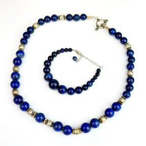 A white metal (tested silver) and lapis lazuli necklace together with a lapis lazuli bracelet.