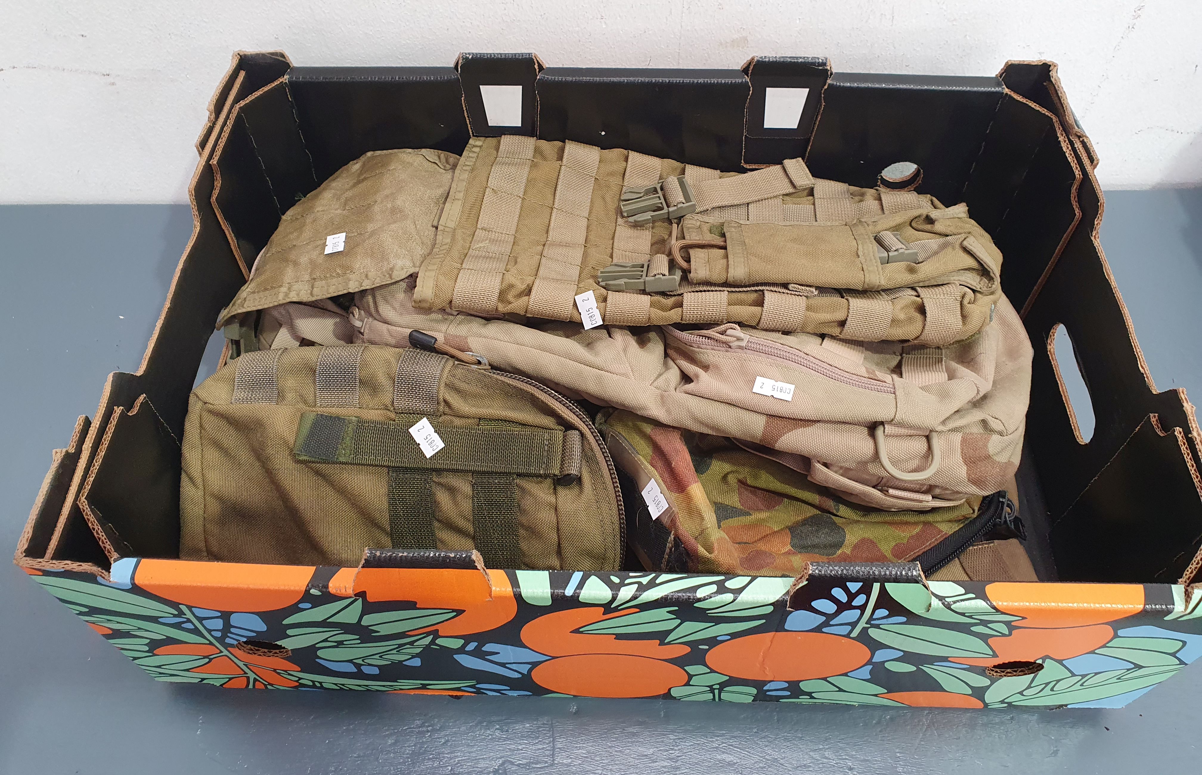 A GROUP OF CAMOUFLAGE BAGS
