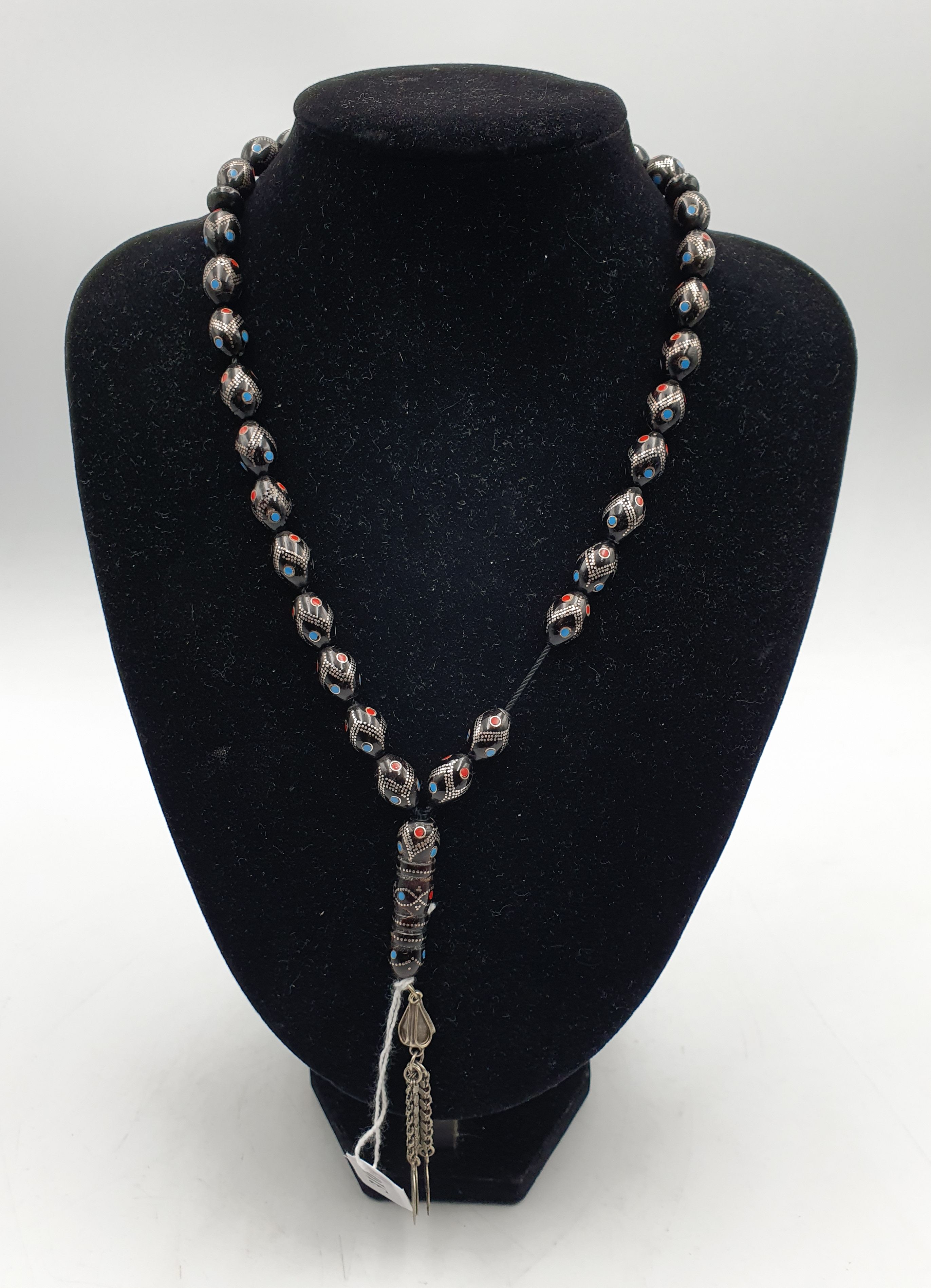 A BLACK CORAL INLAID WITH SILVER PRAYER BEAD SET