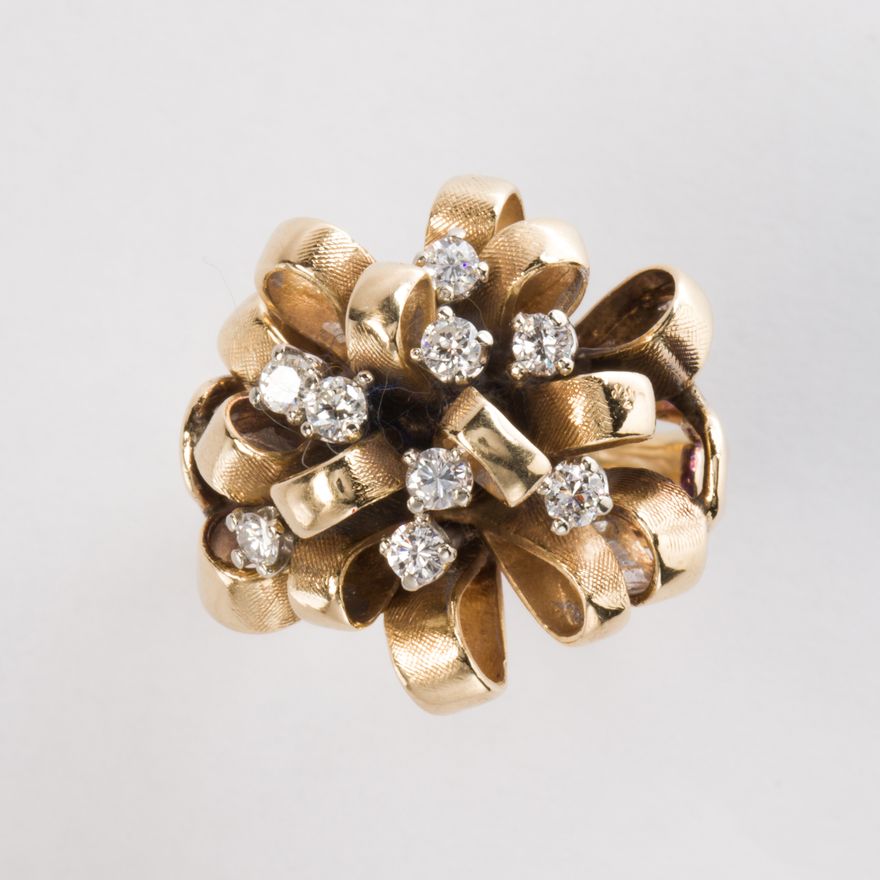 A diamond and fourteen karat gold ring