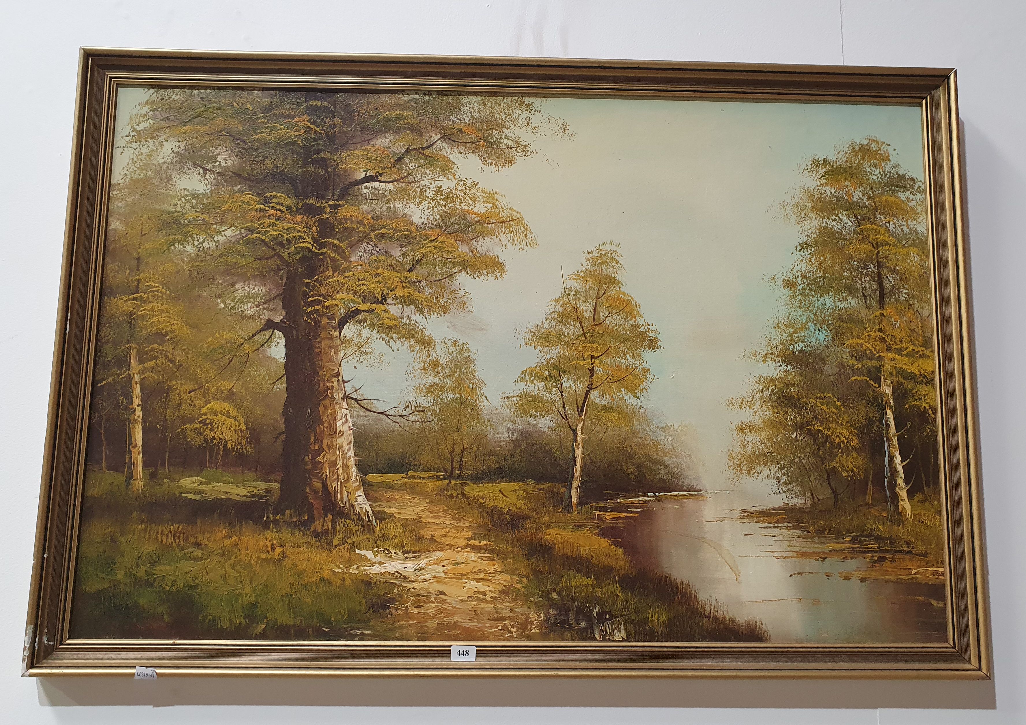 A FRAMED LANDSCAPE PAINTING