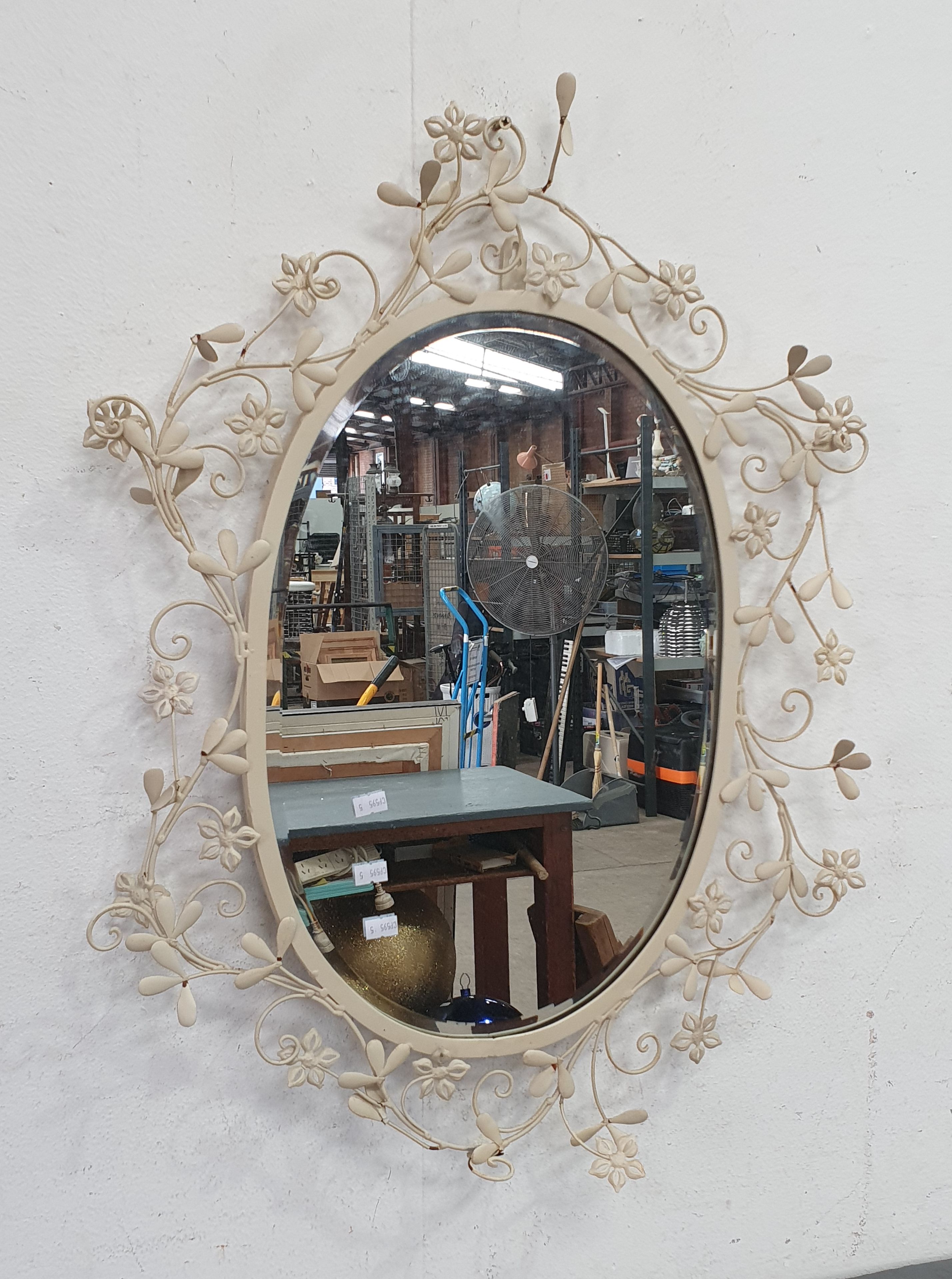 A DECORATIVE GARDEN MIRROR