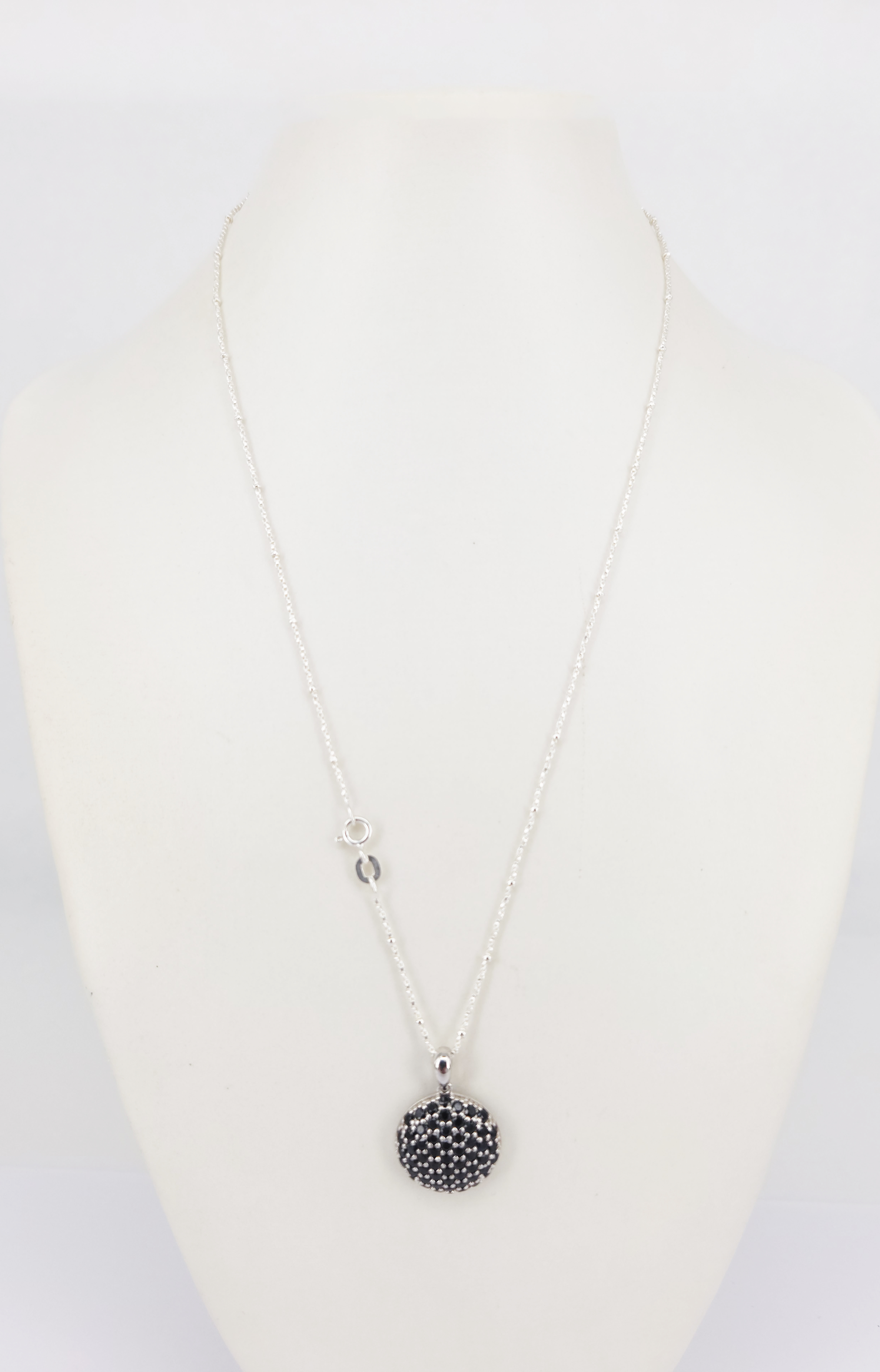 A Silver And Sapphire Cluster Pendant Necklace
