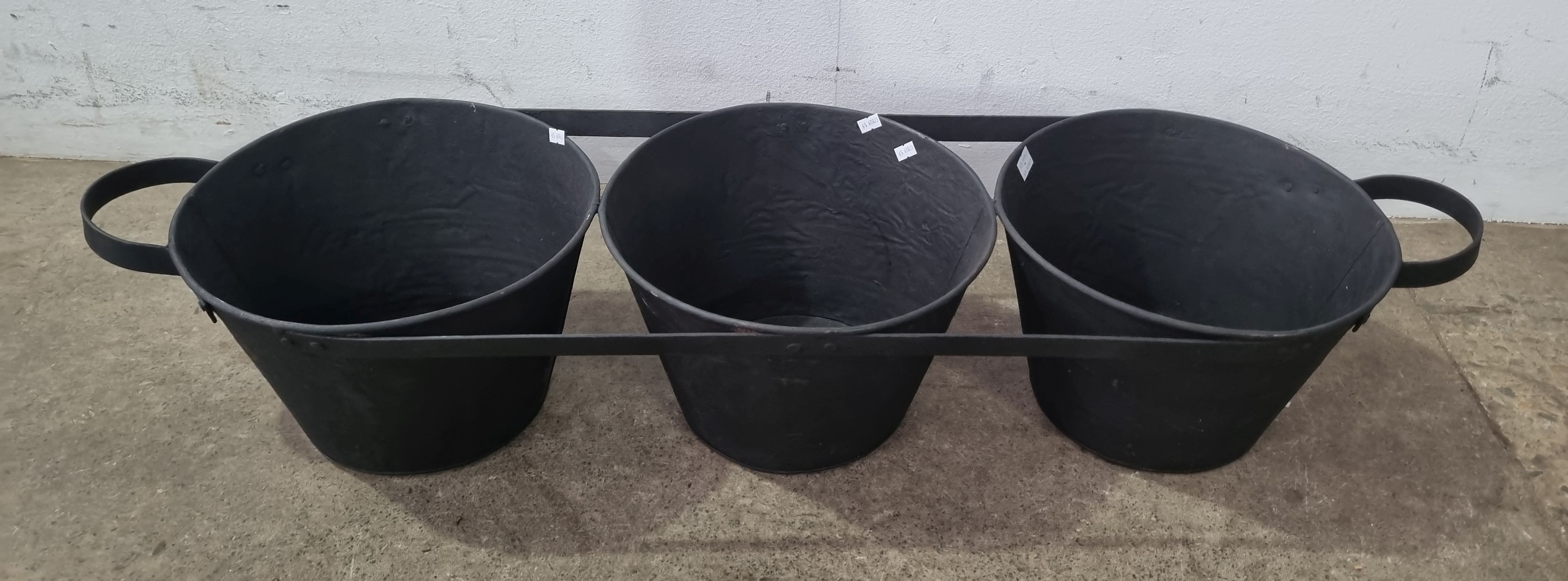 A Metal Three Bucket Plant Holder