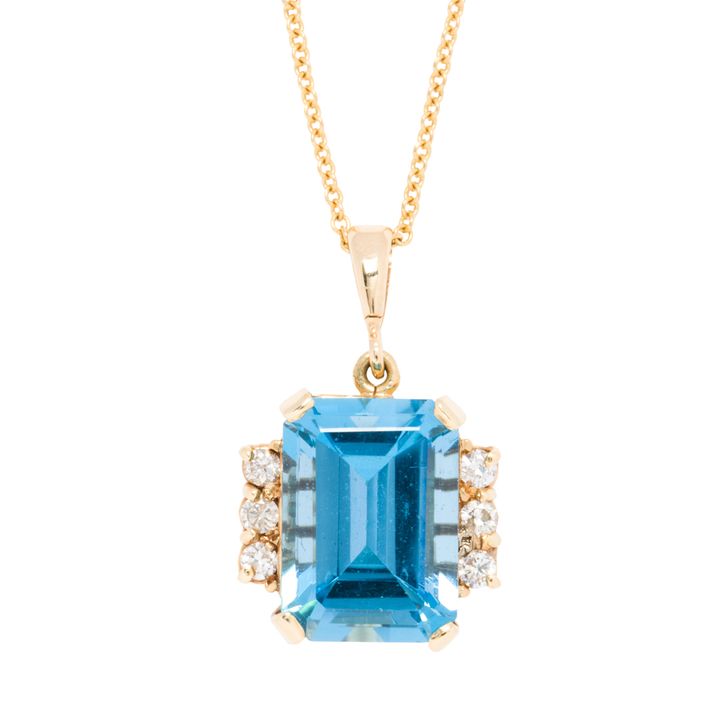 A blue topaz, diamond and 14k gold pendant necklace
