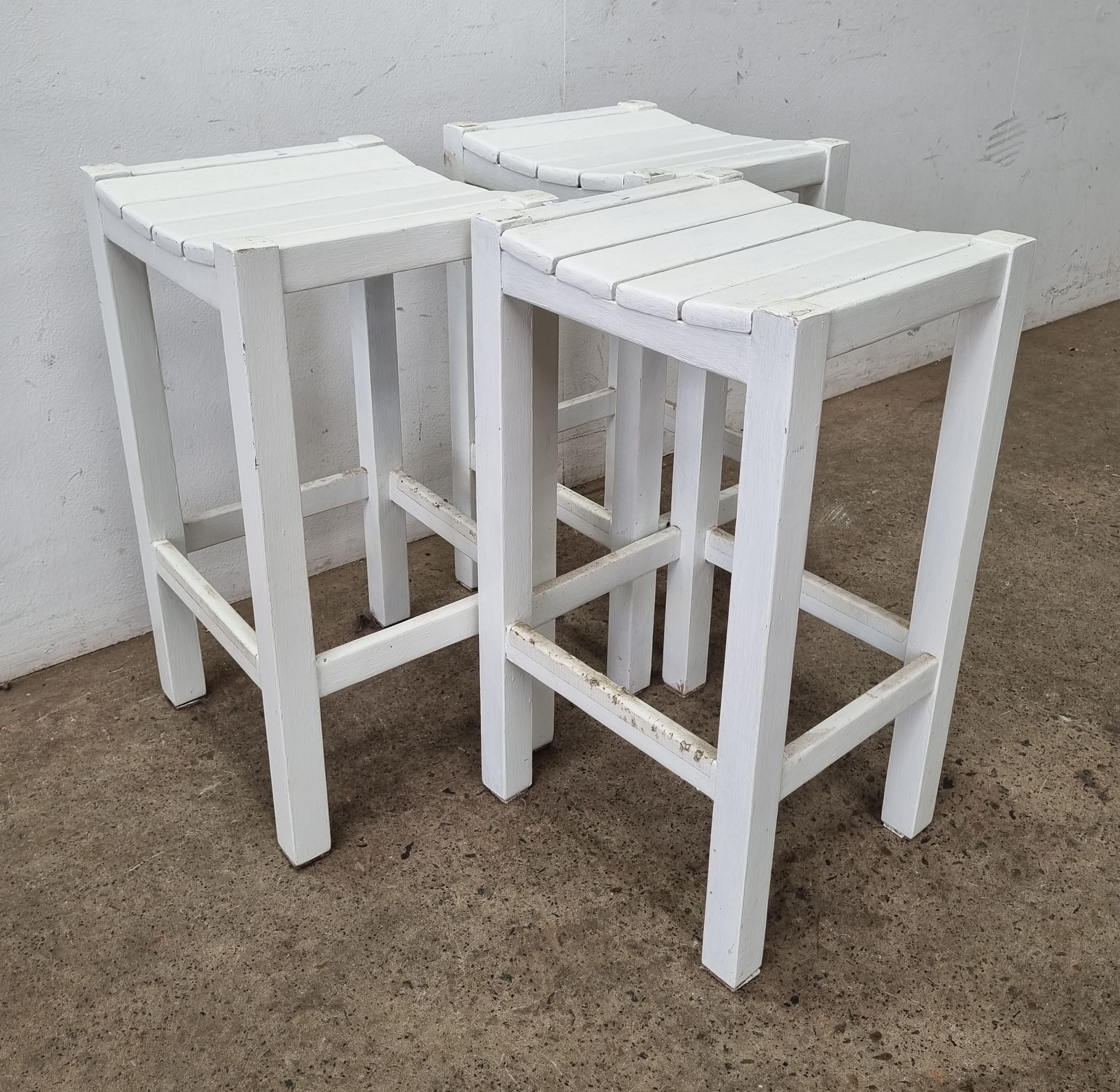 A Set Of Three Bar Stools