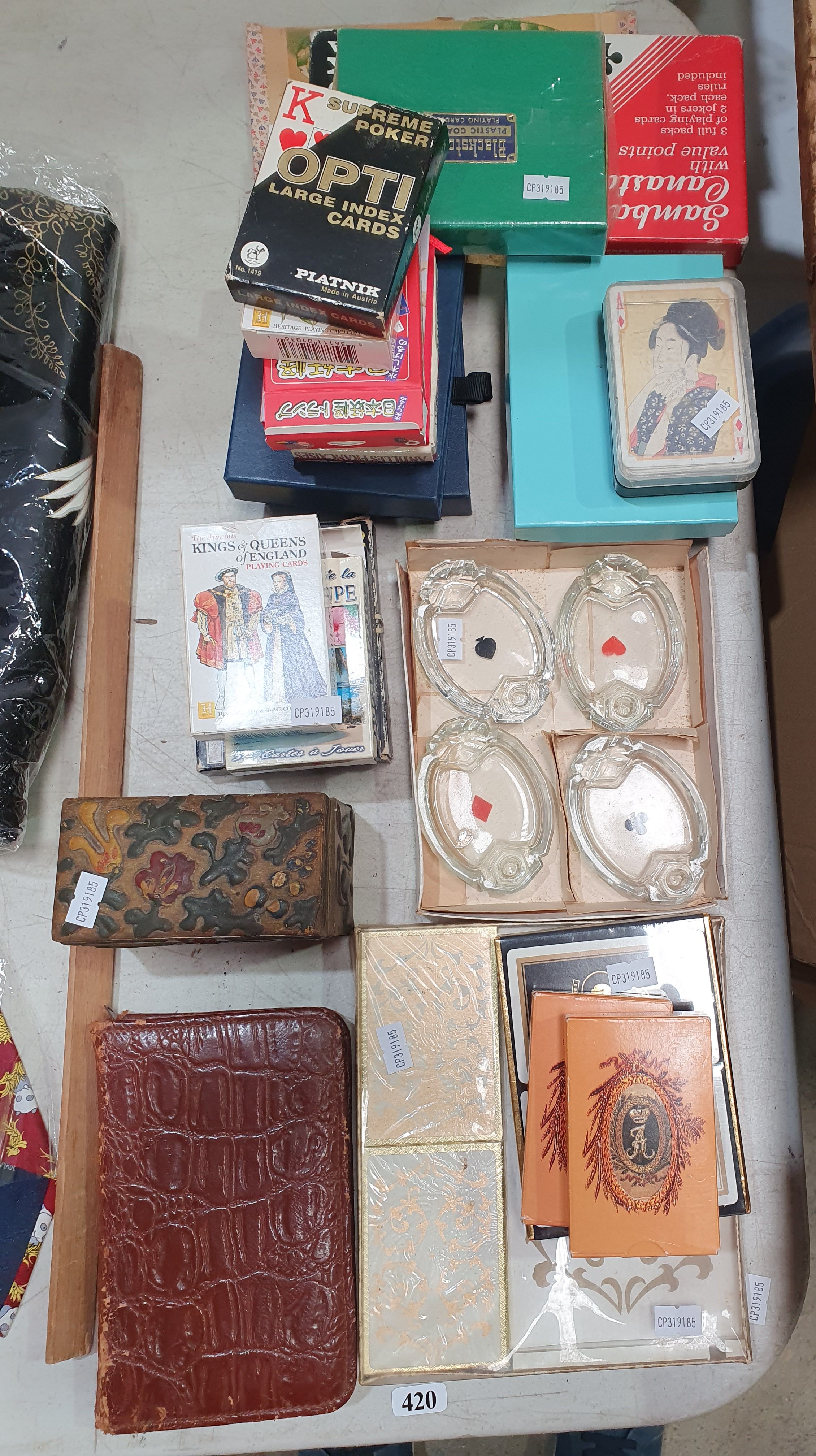 A Collection Of Various Playing Cards And Related Items