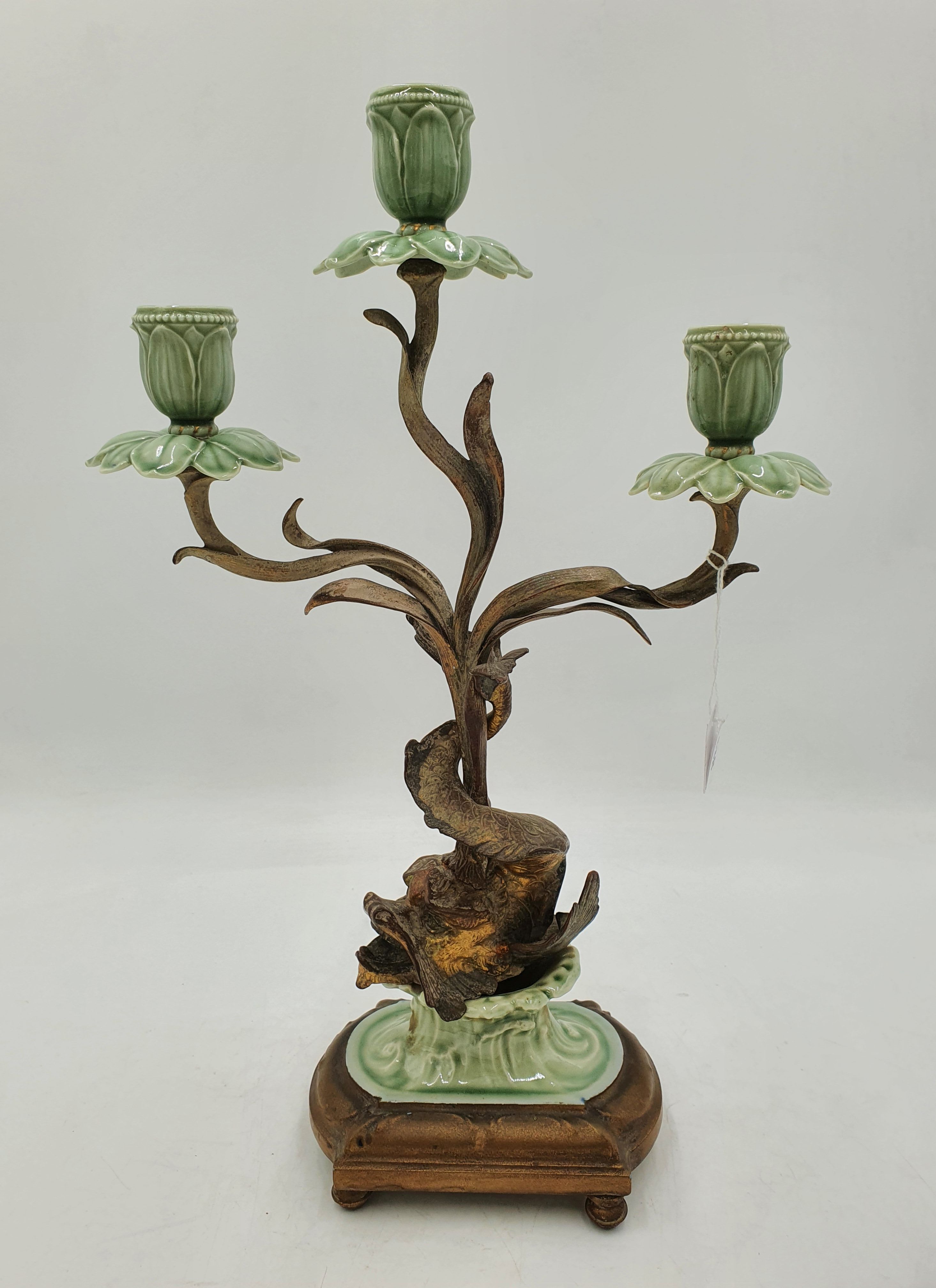 An Art Nouveau Style Brass And Ceramic Dolphin And Floral Three Light Candelabrum