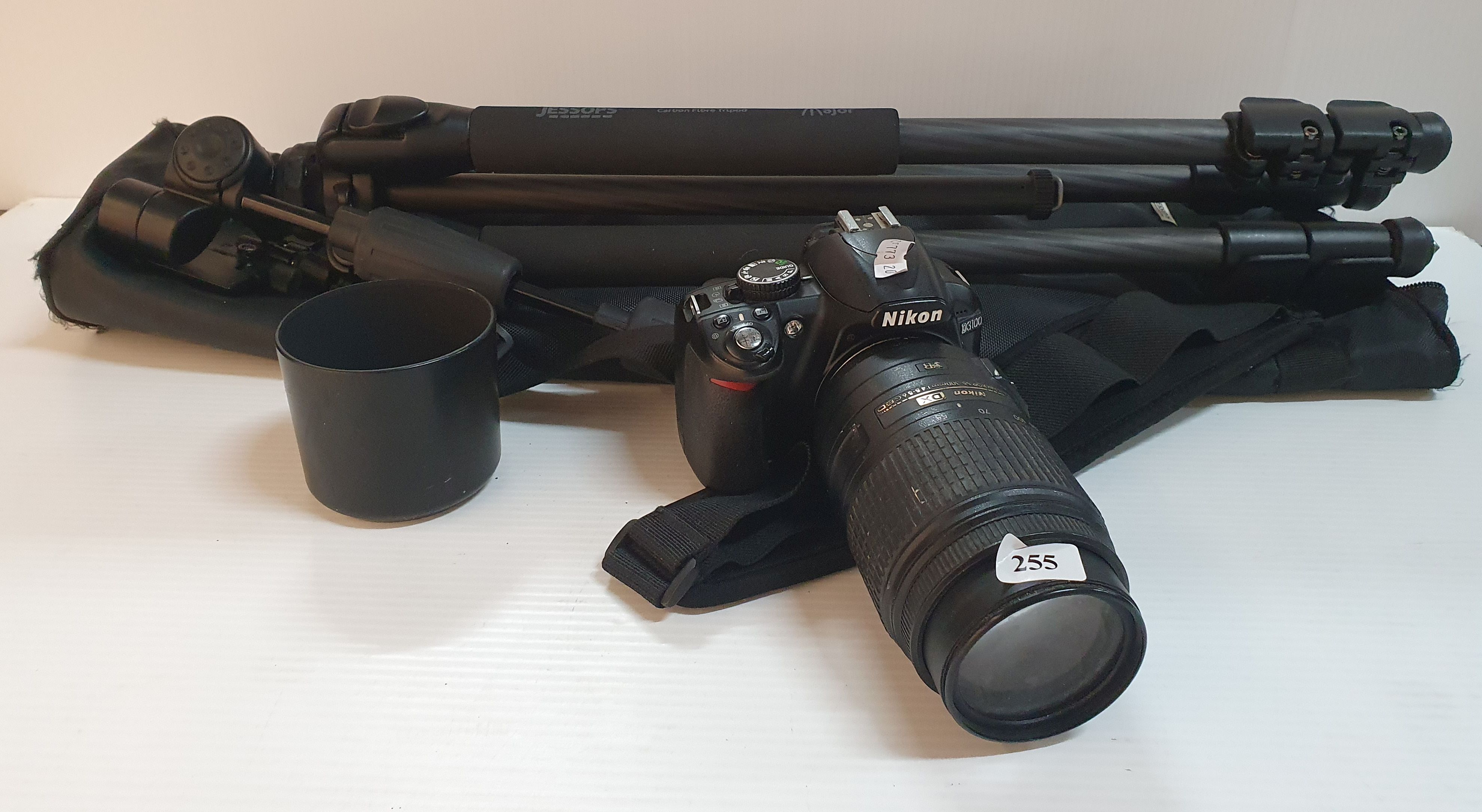 255 · A NIKON CAMERA AND LENS TOGETHER WITH A JESSOPS TRIPOD