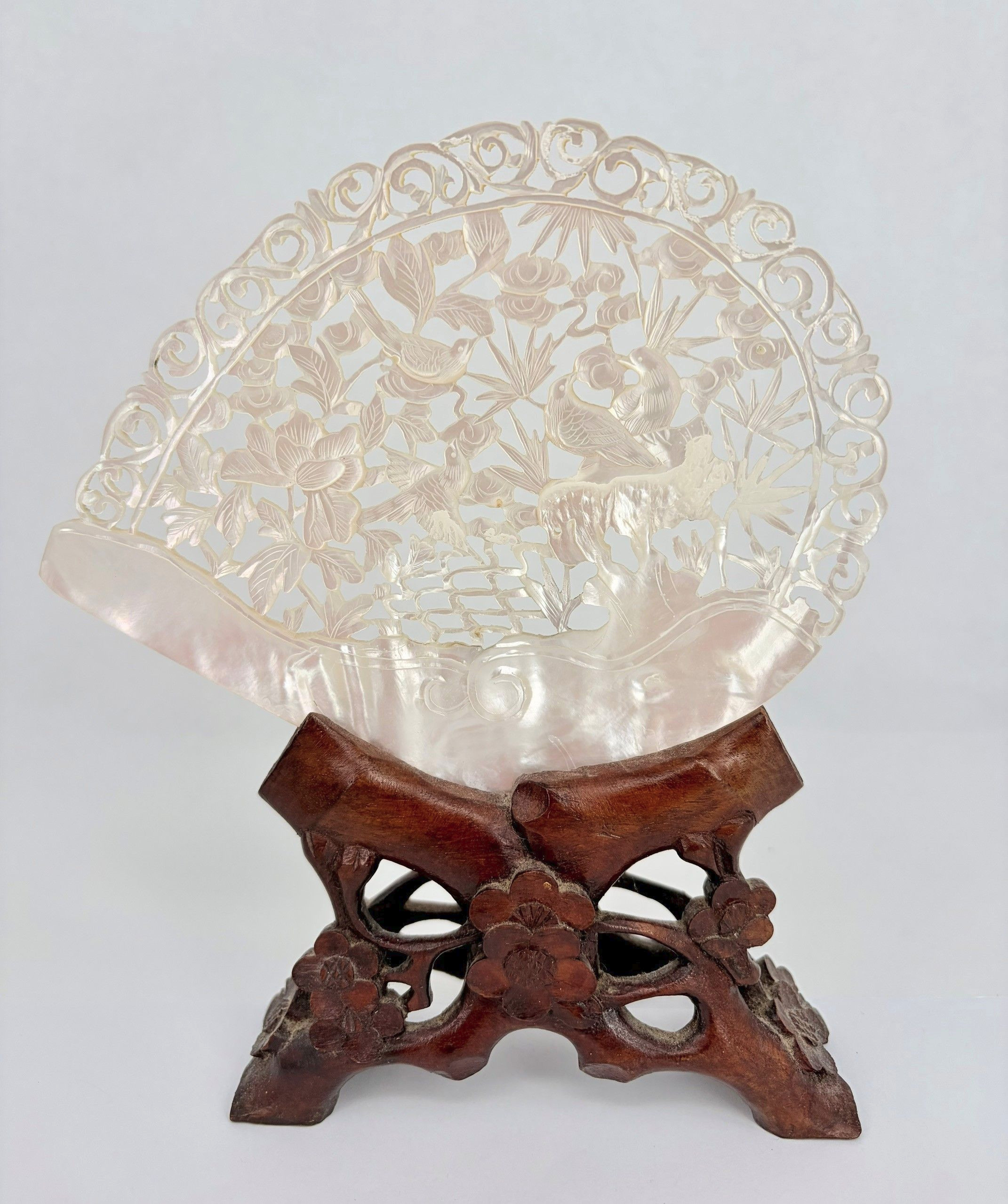 A CHINESE CARVED MOTHER-OF-PEARL SHELL