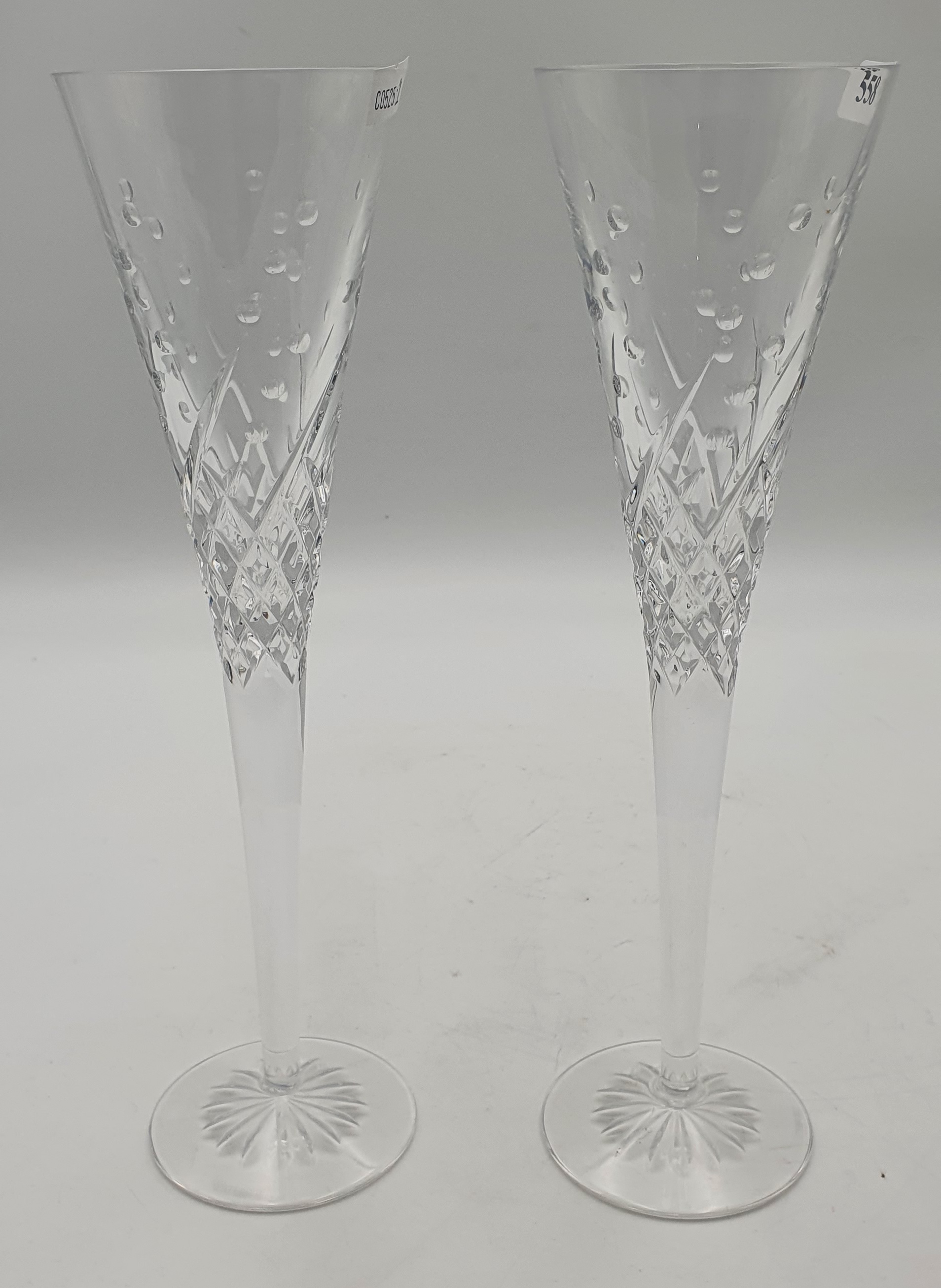 506 · A PAIR OF WATERFORD 'WISHES' CRYSTAL CHAMPAGNE FLUTES