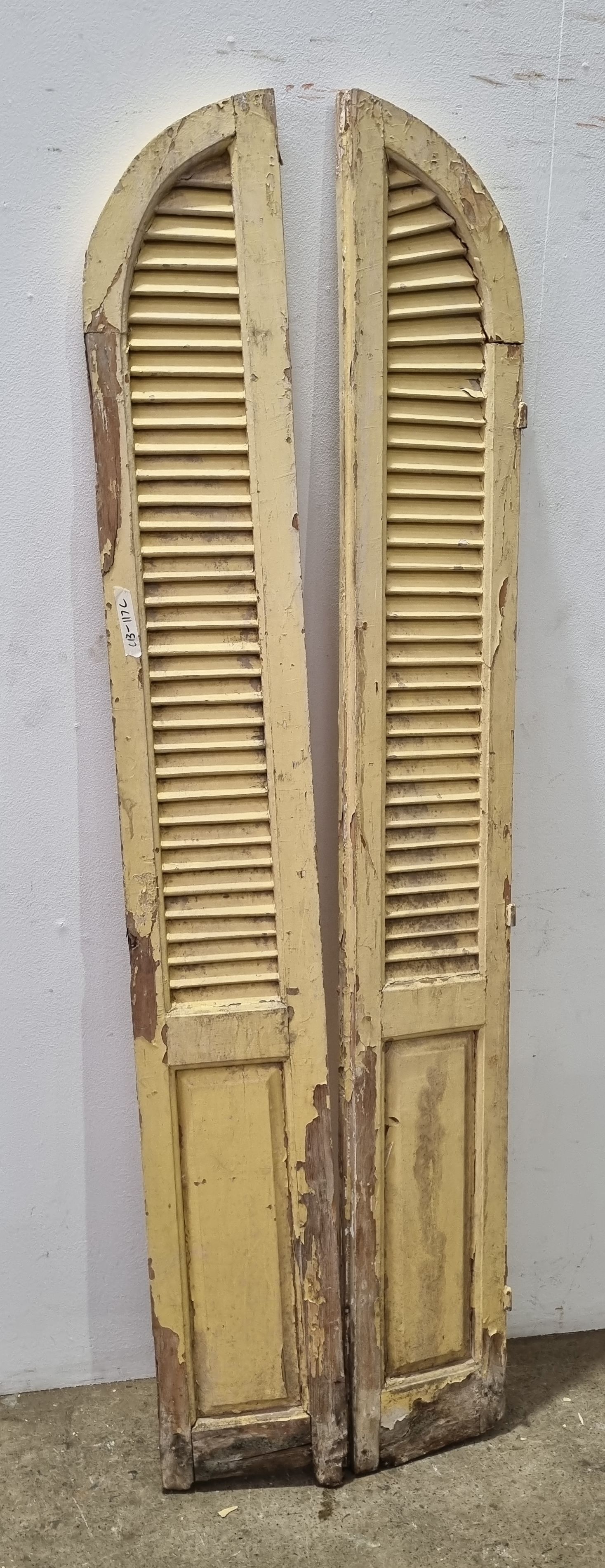 A Set Of Painted Dome Top French Shutters
