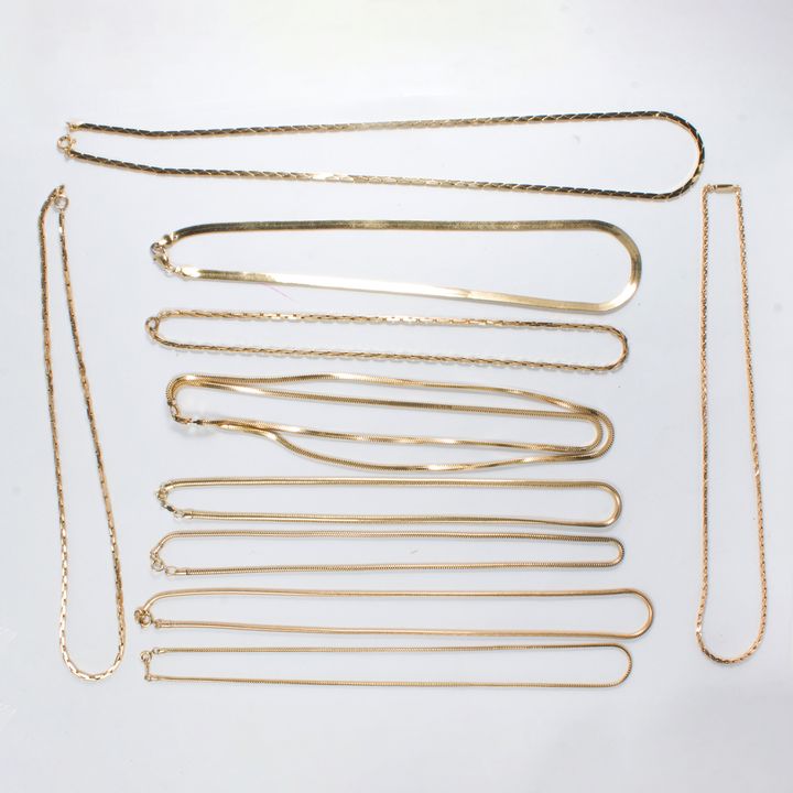 A group of gold plated chains