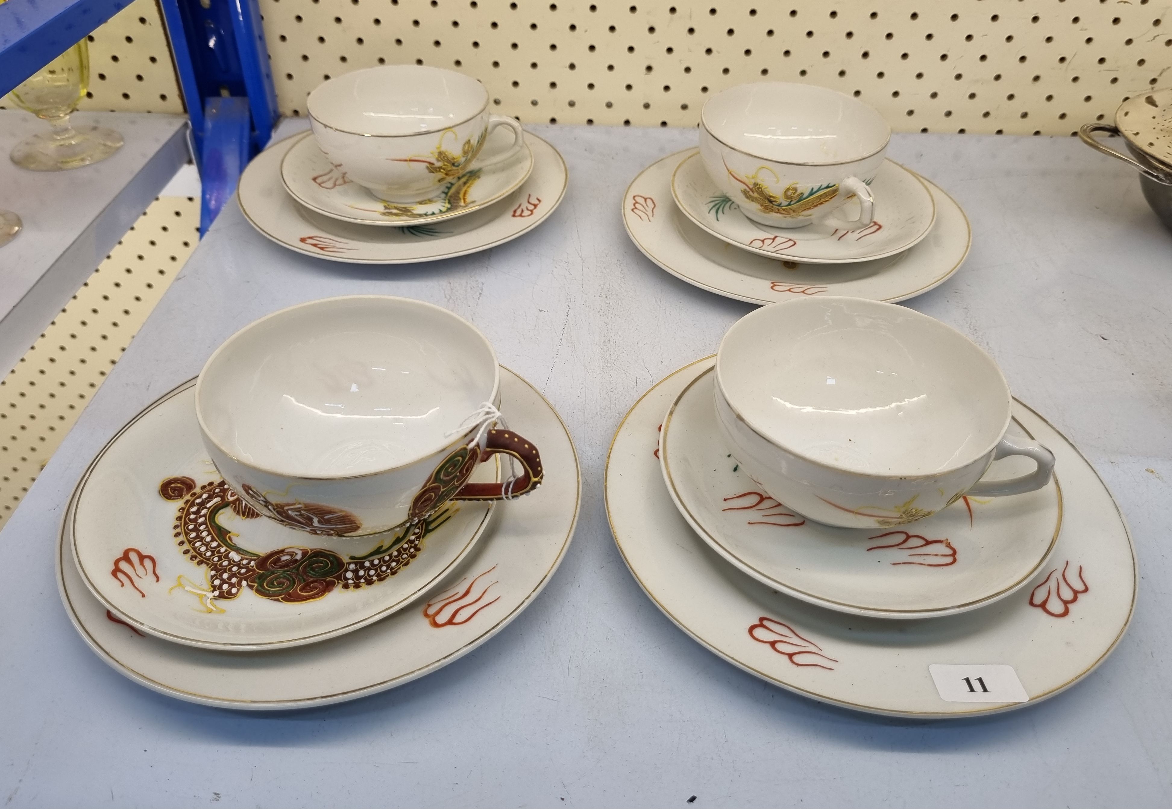 11 · THREE VINTAGE JAPANESE LITHOPHANE TEACUPS AND SAUCERS