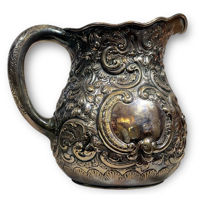 A Sterling Silver Repousse Water Pitcher PICKSLAY
