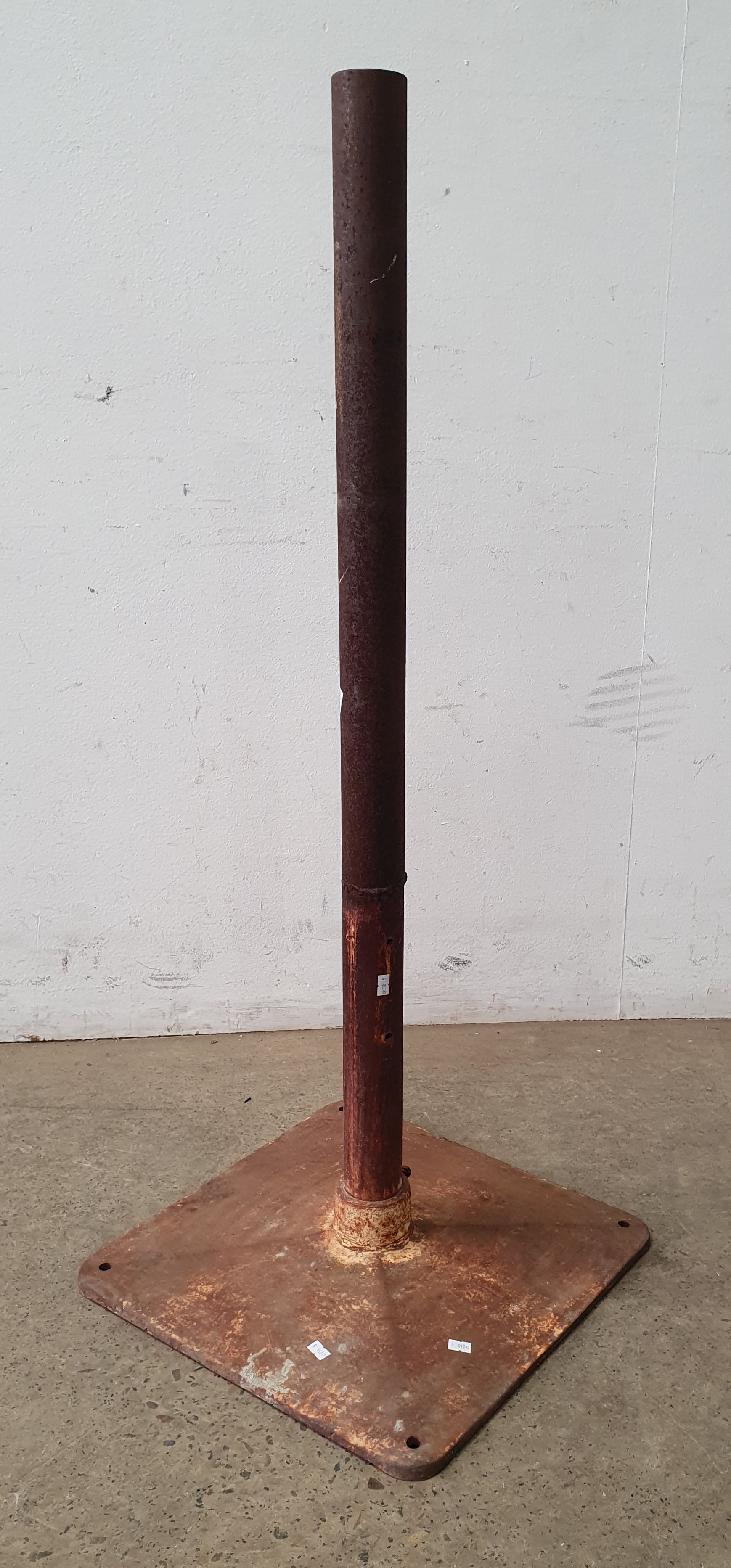 A Rustic Metal Umbrella Stand
