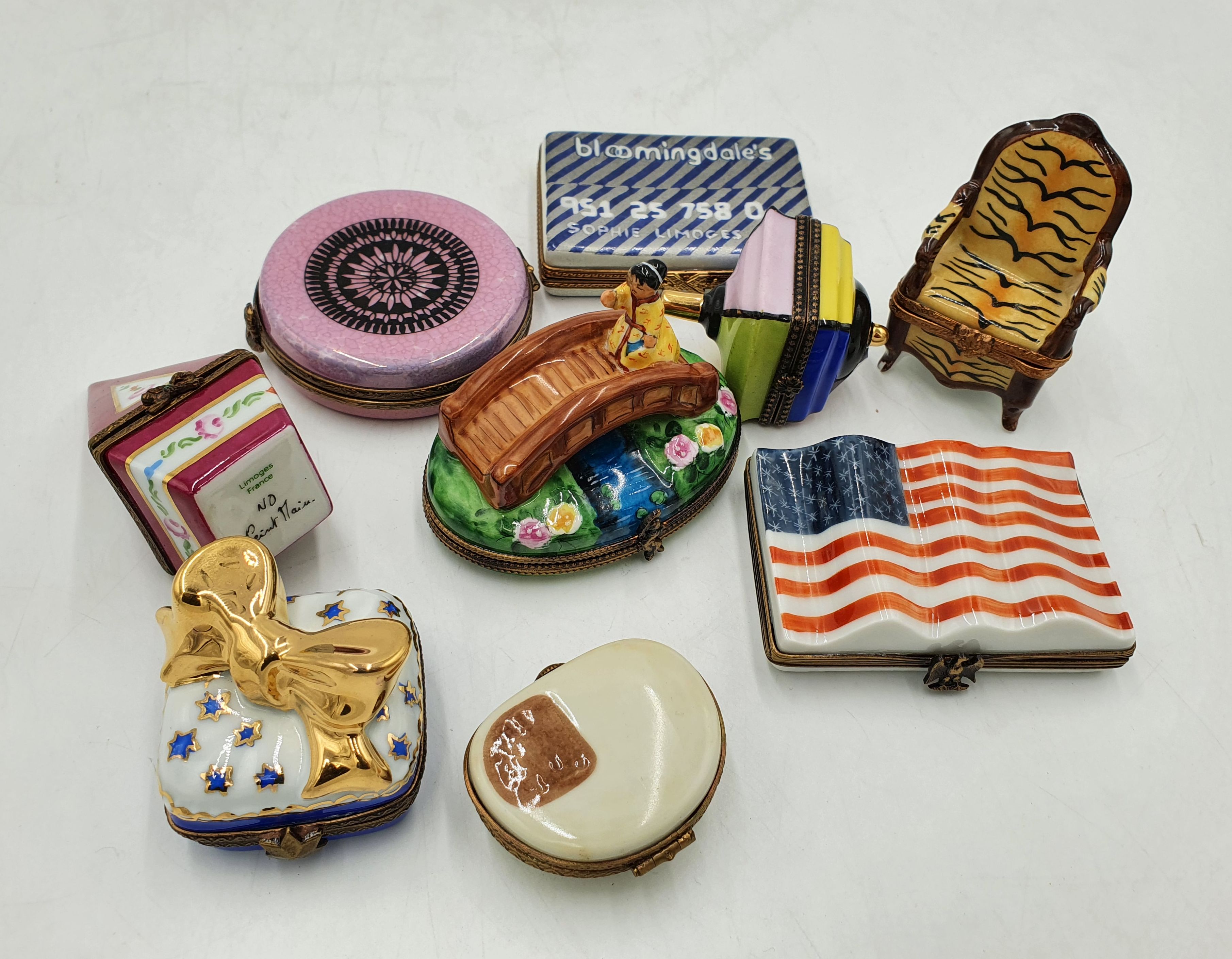 556 · NINE LIMOGES PORCELAIN TRINKET BOXES