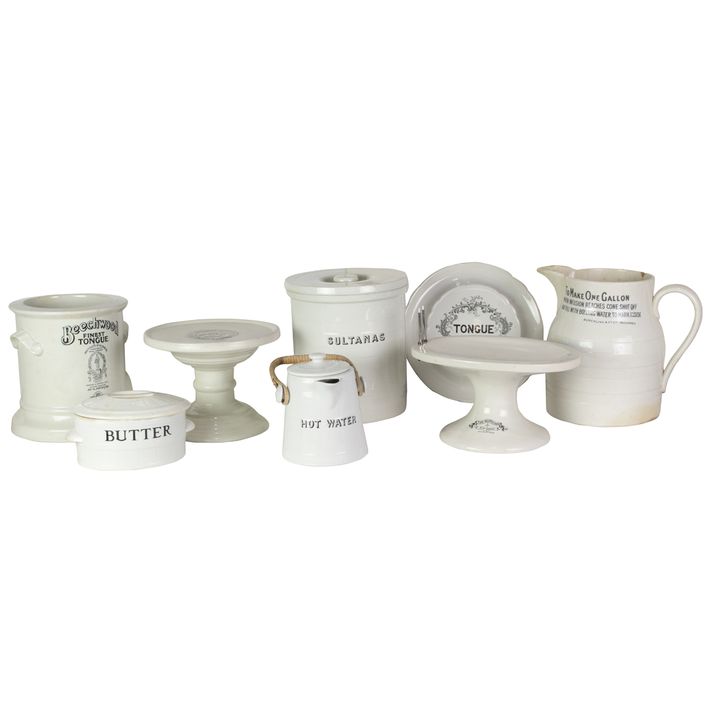 A group of English ironstone advertising display stands and containers